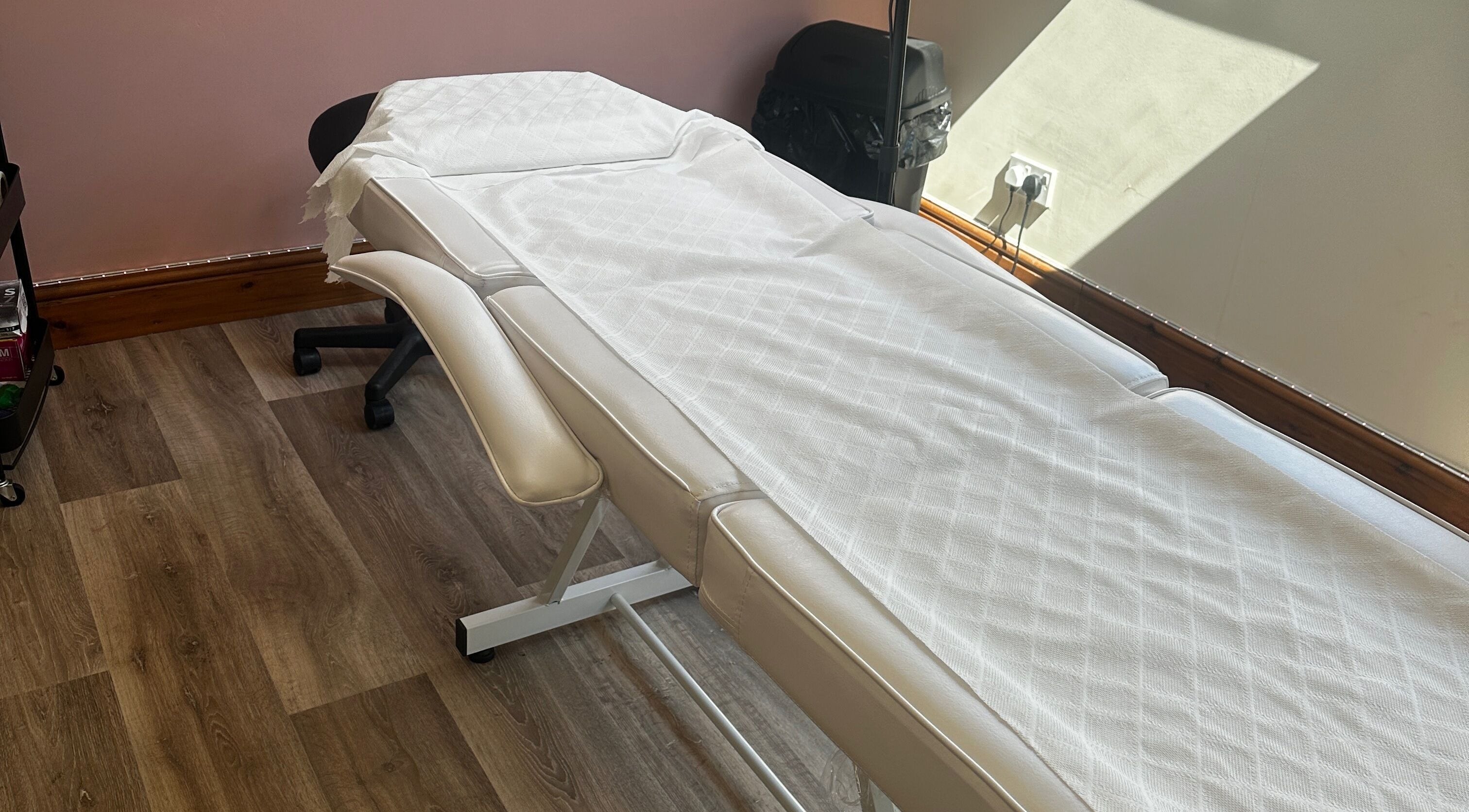 Comfortable treatment bed at Restore - Pmu & Aesthetics, Hythe, England, GB, offering serene wellness services.