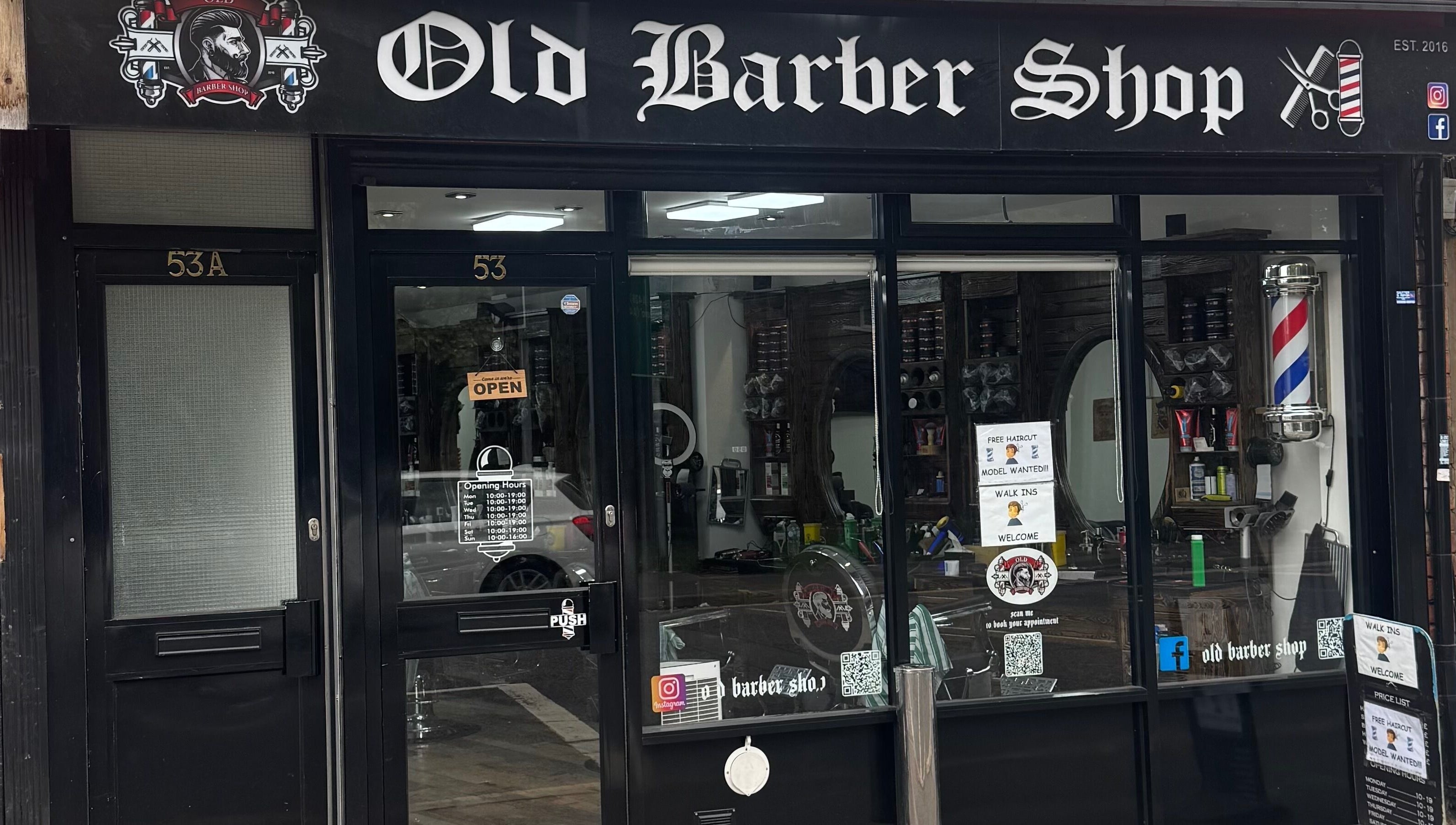 Entrance of Old Barber Shop in Northampton, England, GB showcasing vintage style and decor.