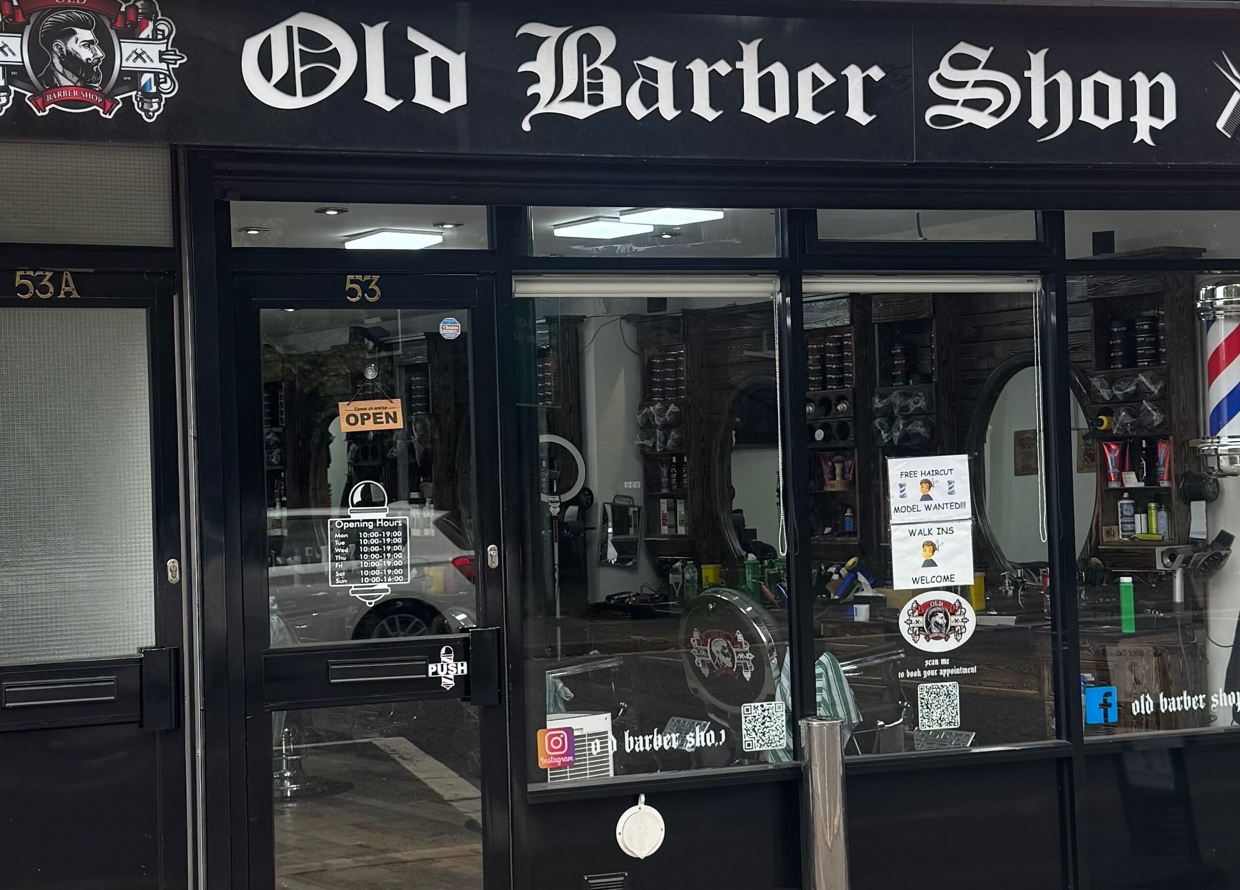Entrance of Old Barber Shop in Northampton, England, GB showcasing vintage style and decor.