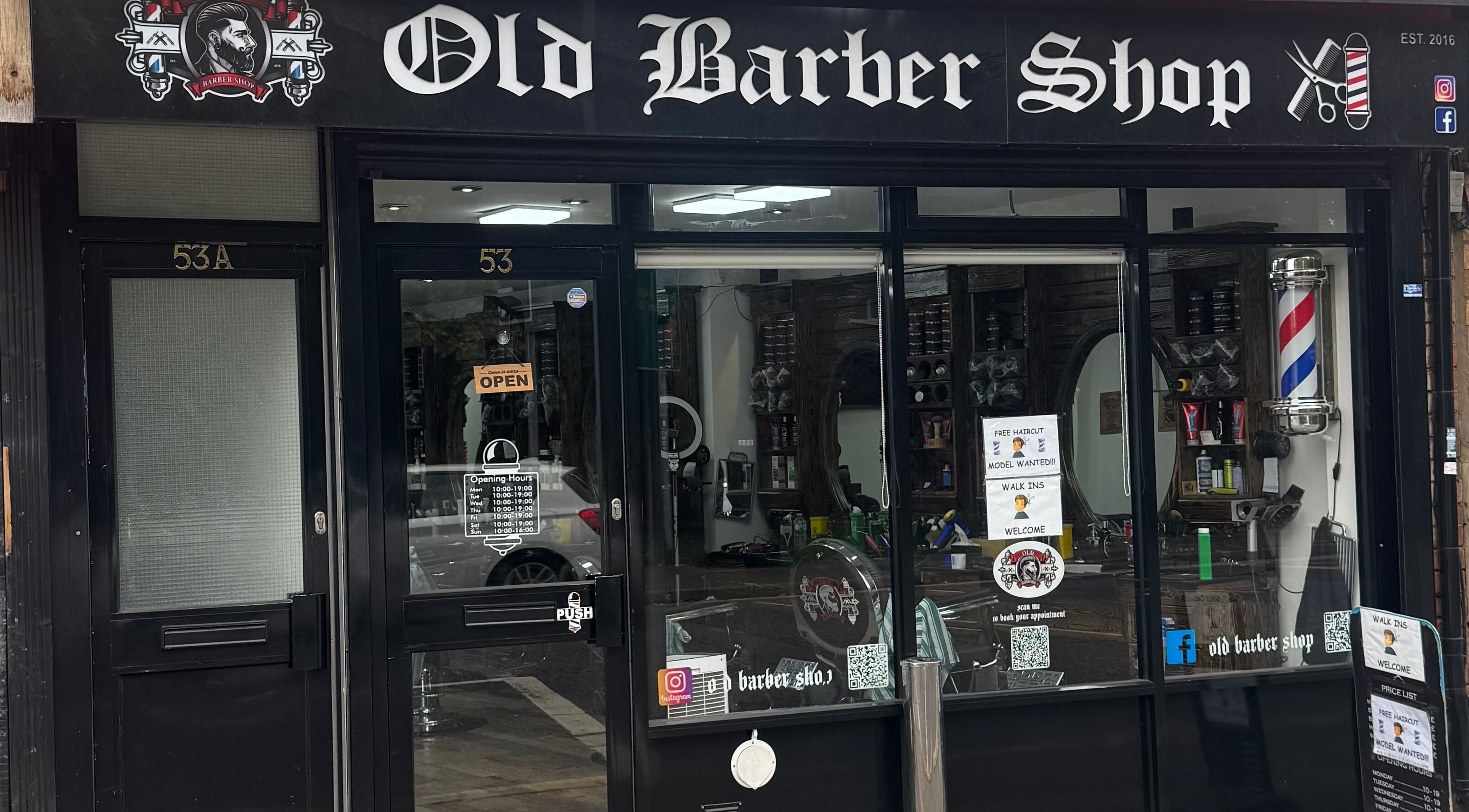 Entrance of Old Barber Shop in Northampton, England, GB showcasing vintage style and decor.