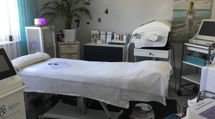Relaxing spa room at Cambridge Cosmetology, Cambridge, England, GB, with treatment bed and equipment.