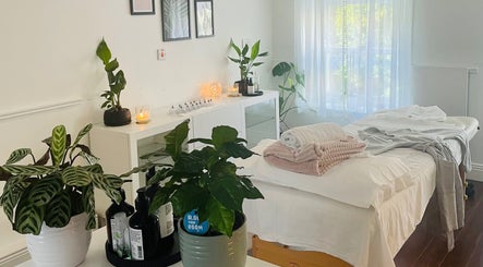 Peaceful massage room at Logan Joy Massage and Beauty, Limerick, County Limerick, IE with plants and sunlight.