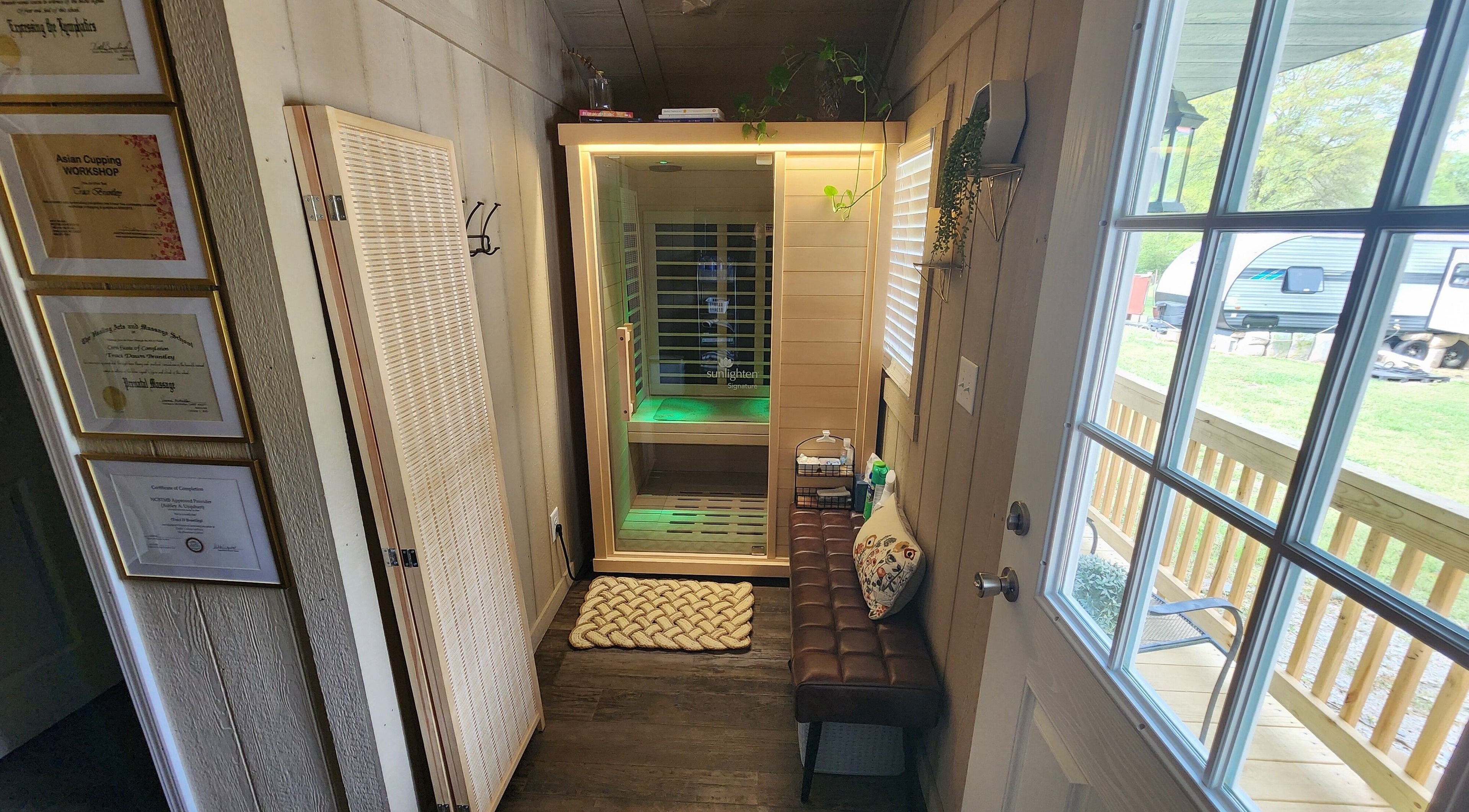 Inviting relaxation space at CFM in Clayton, North Carolina, US with certificates and sauna room.