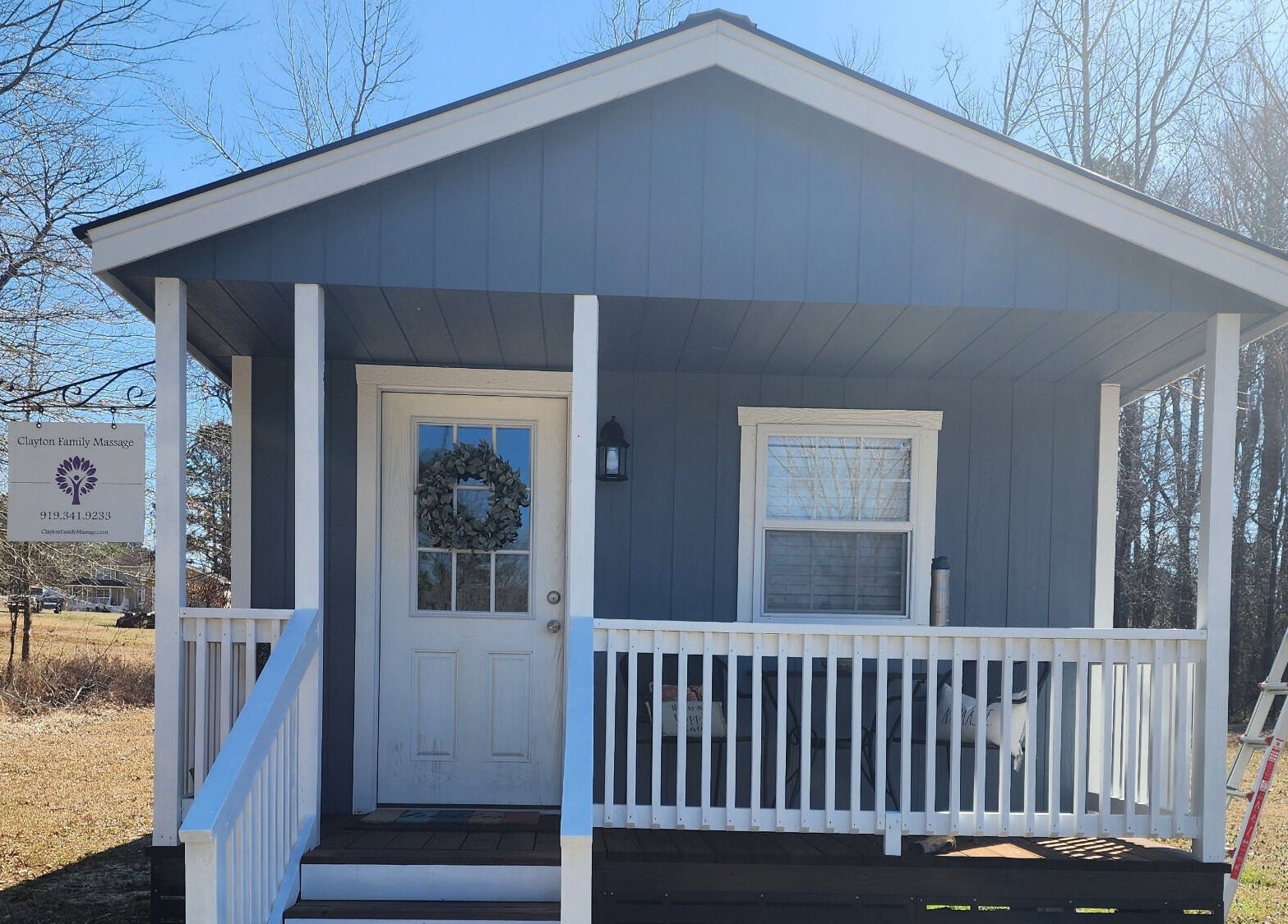 Front view of CFM's serene blue cottage in Clayton, North Carolina, US.