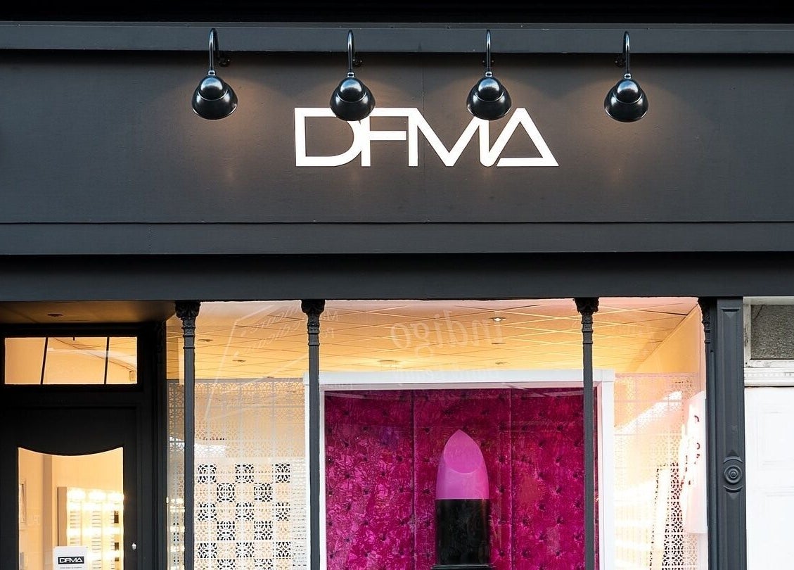 Dfma Make Up & Hair Bar in Poole, England, GB features a sleek black facade and a vibrant interior.