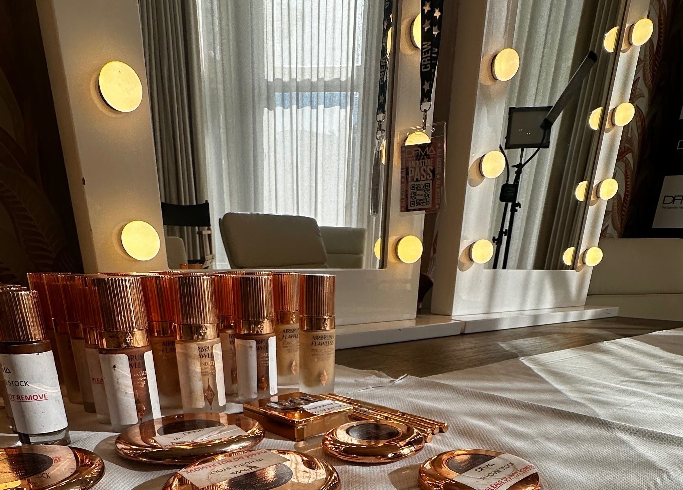 Makeup and mirrors at Dfma Make Up & Hair Bar in Poole, England, GB, reflecting a chic beauty ambiance.