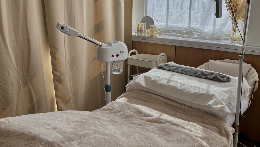 Relaxing treatment room at AmyEBeauty in Suffolk, England, GB, featuring a cozy bed and soothing decor.