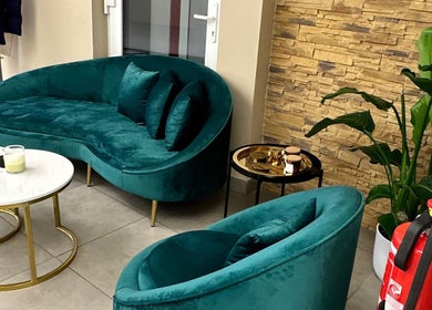 Elegant teal seating in Boni Beauty Clinic's stylish lounge, Luxembourg, Luxembourg, LU.