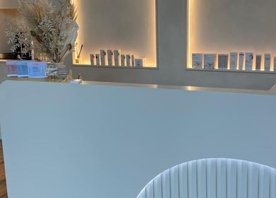 Beauty By Amineh reception area, Cambridge, England, GB featuring modern decor and product displays.