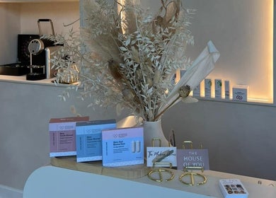 Beauty By Amineh's elegant reception in Cambridge, England, showcasing premium wellness products and decor.