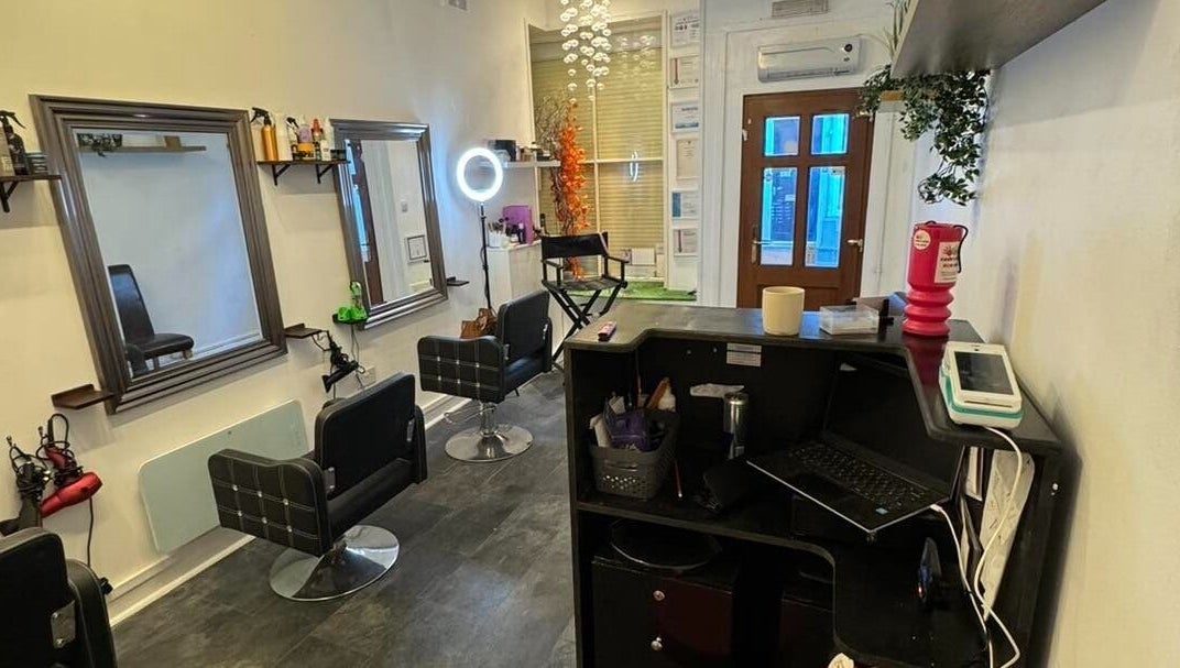 Interior of The Lounge Forres Ltd in Forres, Scotland, GB, featuring modern salon chairs and mirrors.
