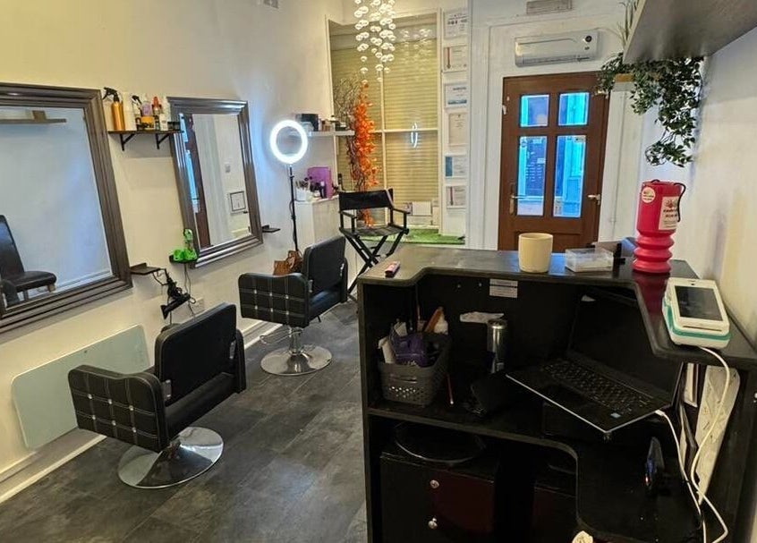 Interior of The Lounge Forres Ltd in Forres, Scotland, GB, featuring modern salon chairs and mirrors.