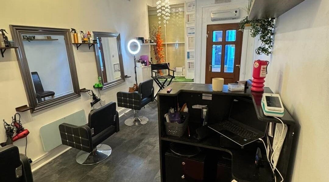 Interior of The Lounge Forres Ltd in Forres, Scotland, GB, featuring modern salon chairs and mirrors.