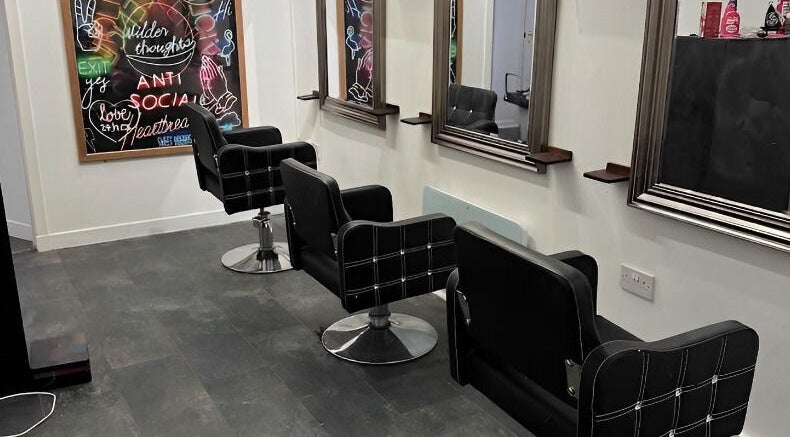 Elegant salon chairs and mirrors at The Lounge Forres Ltd, Forres, Scotland, GB, showcasing modern interior.