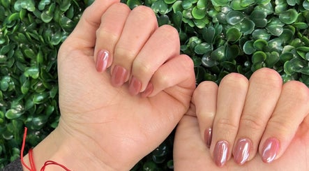 Glossy manicure showcasing elegant nails at Dominican Salon - West Kendall, Miami, Florida, US.