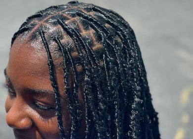Intricate braided hairstyle at Nonniestylez in Decatur, Georgia, US showcases expert styling.