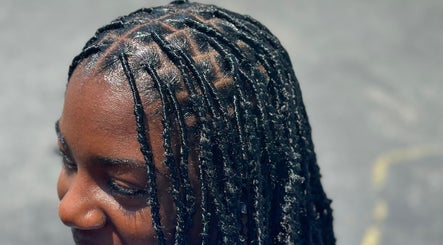 Intricate braided hairstyle at Nonniestylez in Decatur, Georgia, US showcases expert styling.