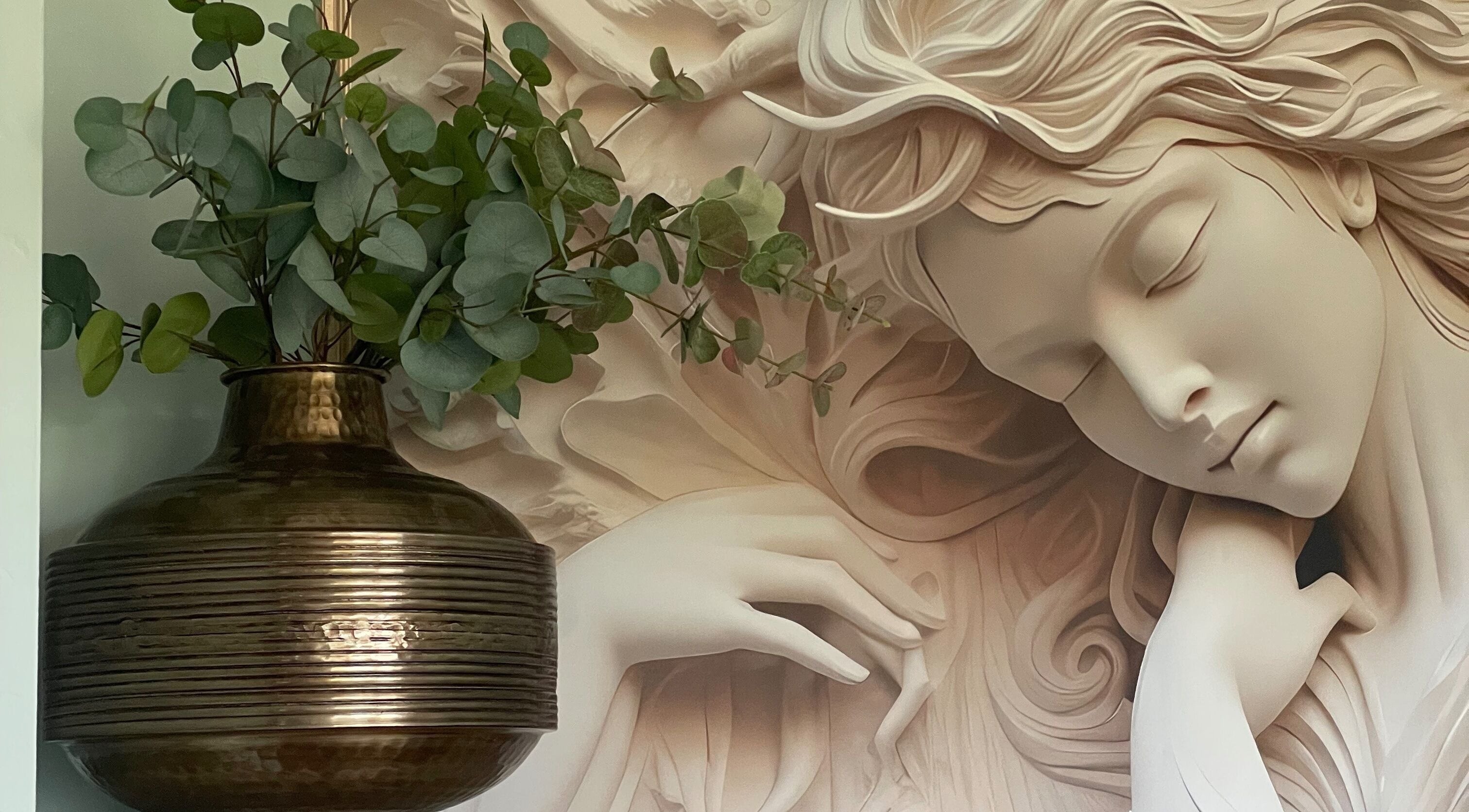 Serene sculpture with greenery at Oxley Aesthetics, Hemel Hempstead, England, GB, enhancing tranquil ambiance.