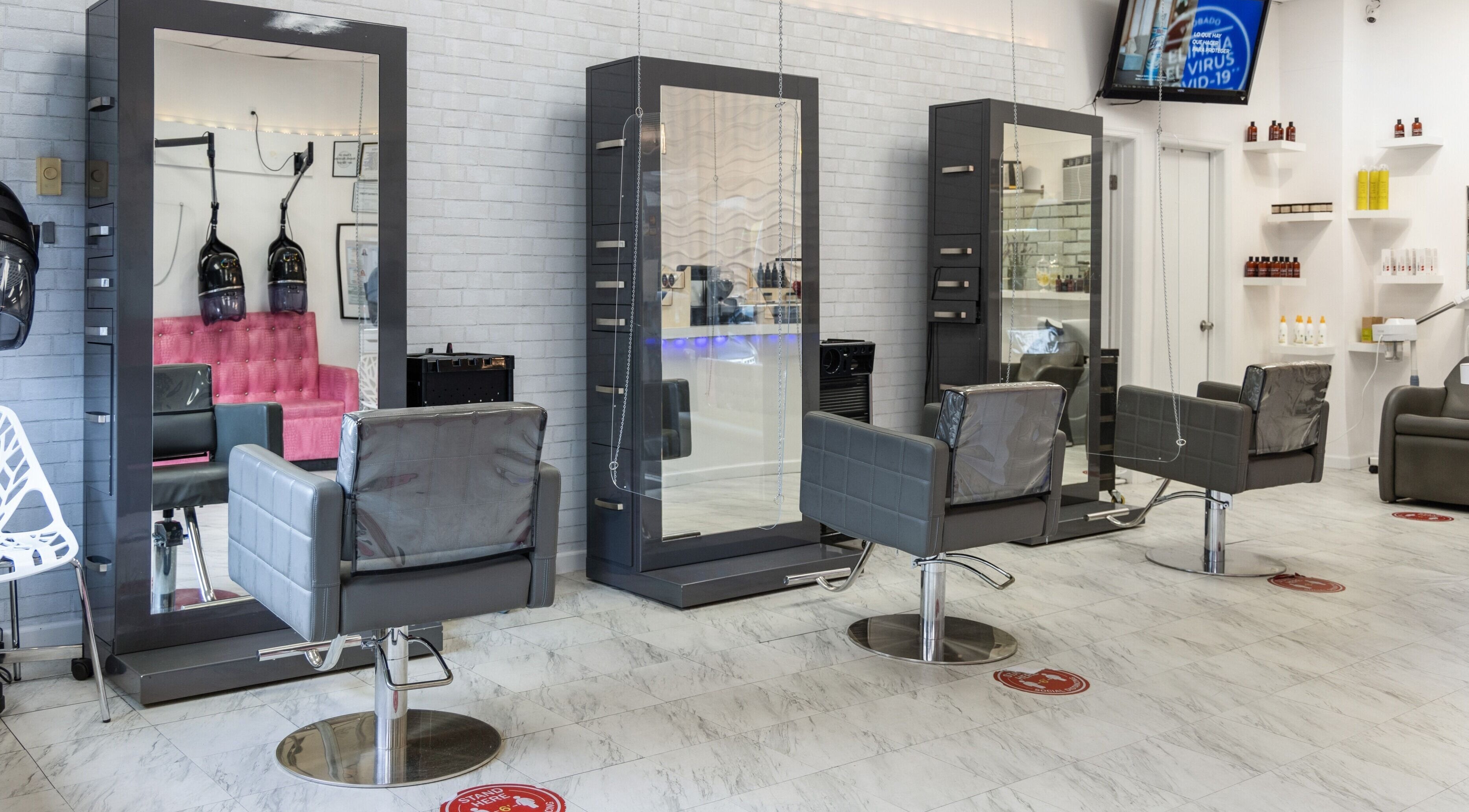 Stylish salon interior at NIKKI MAAR SALON, West New York, New Jersey, US featuring modern chairs and mirrors.