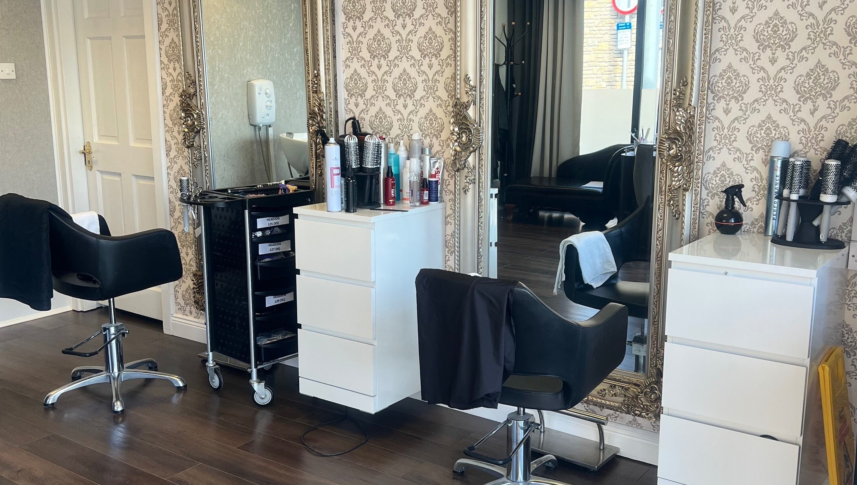 Stylish interior of Cristyle Hair And Beauty in Mullingar, County Westmeath, IE featuring chic salon chairs and mirrors.