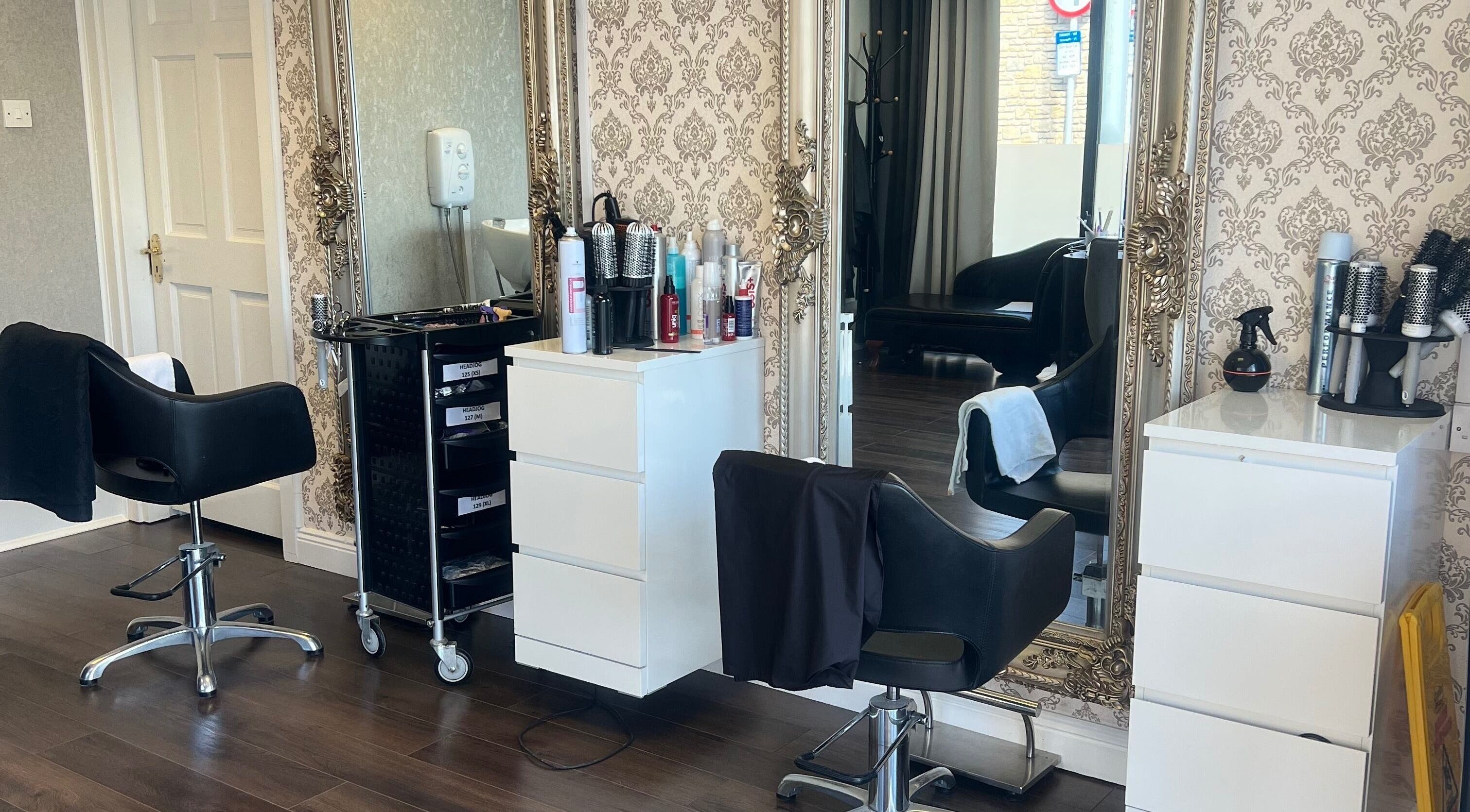 Stylish interior of Cristyle Hair And Beauty in Mullingar, County Westmeath, IE featuring chic salon chairs and mirrors.