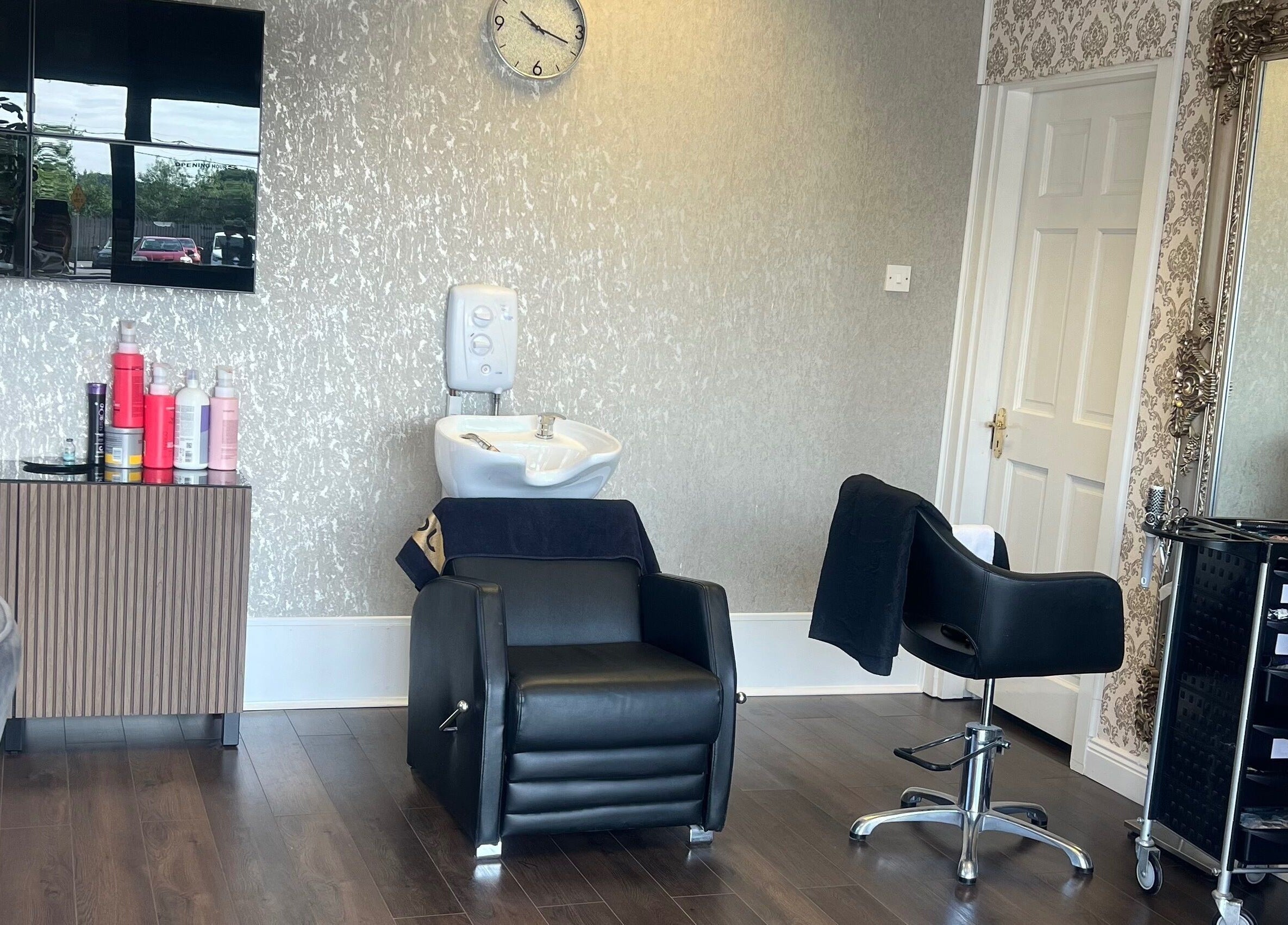 Modern salon interior at Cristyle Hair And Beauty, Mullingar, County Westmeath, IE with stylish chairs and mirrors.