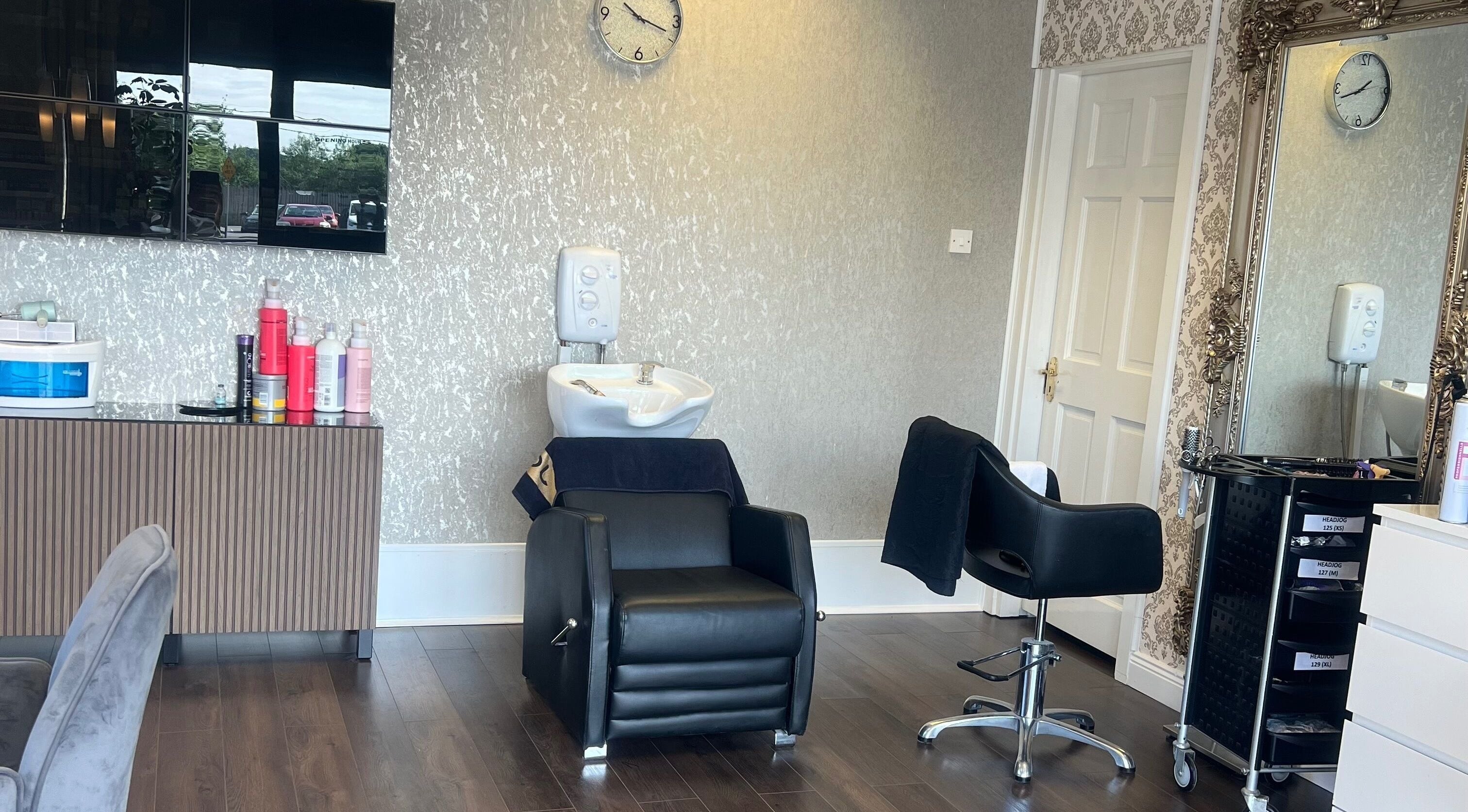 Modern salon interior at Cristyle Hair And Beauty, Mullingar, County Westmeath, IE with stylish chairs and mirrors.