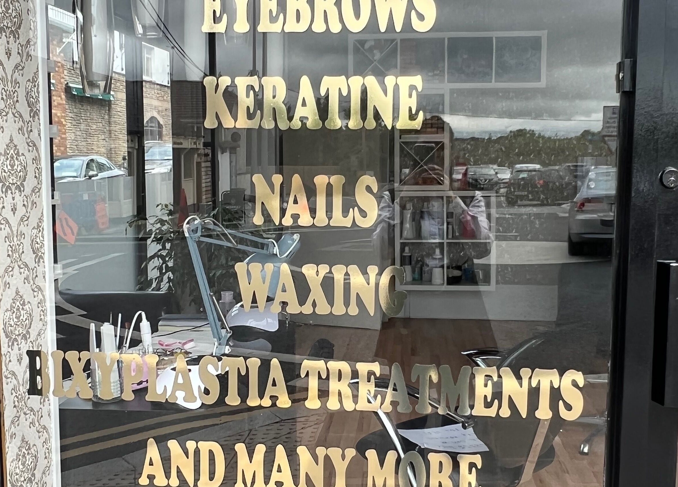 Front window at Cristyle Hair And Beauty, Mullingar, County Westmeath, IE showcasing services like nails and waxing.