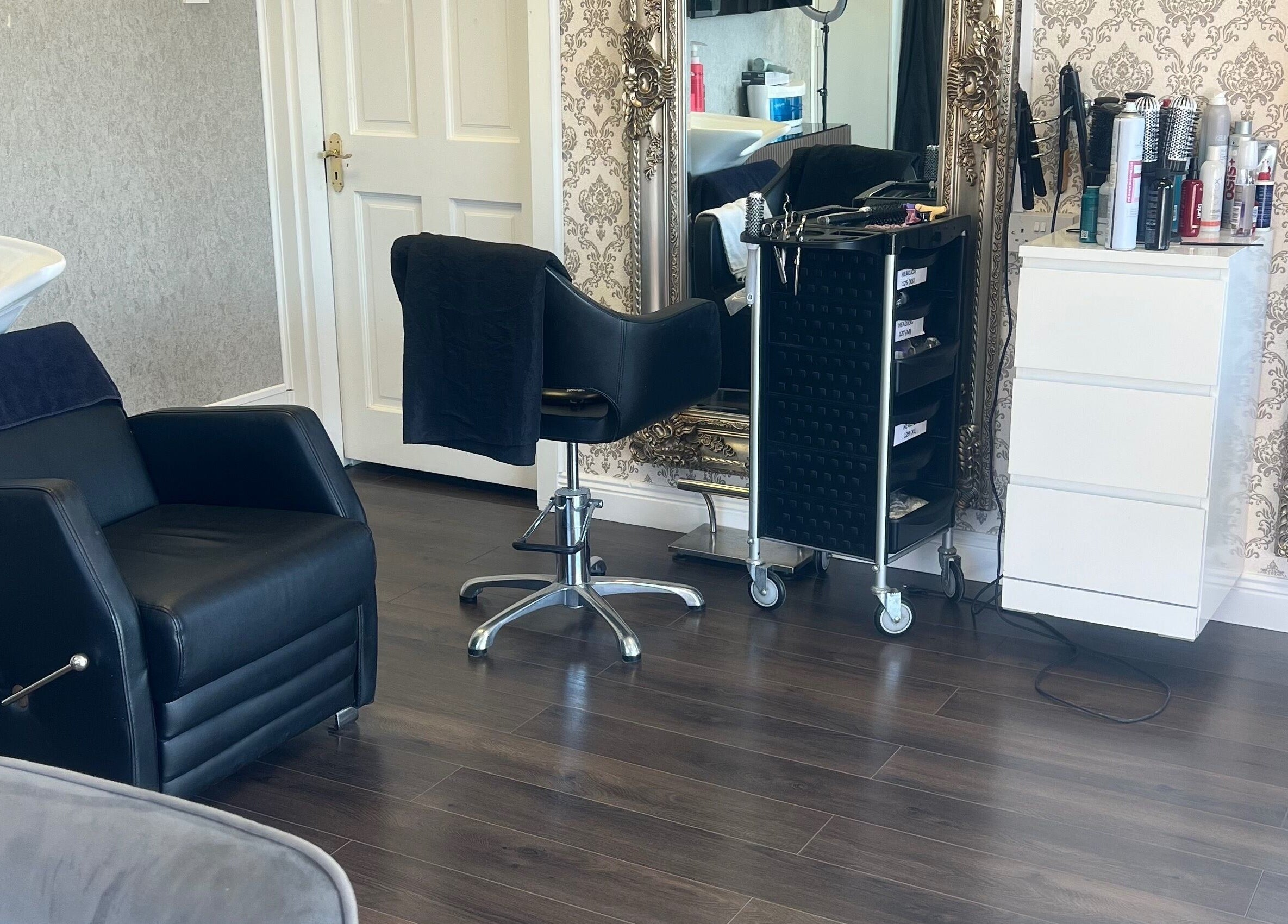 Stylish interior of Cristyle Hair And Beauty in Mullingar, County Westmeath, IE, featuring chic salon chairs and mirrors.