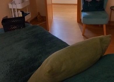 Relaxing spa room at Aura Therapies, Dronfield Derbyshire, England, featuring a plush treatment bed.