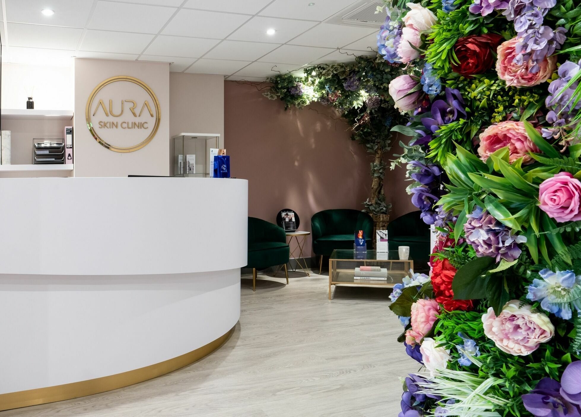 Aura Skin Clinic reception with elegant floral decor in Milton Keynes, England, GB.