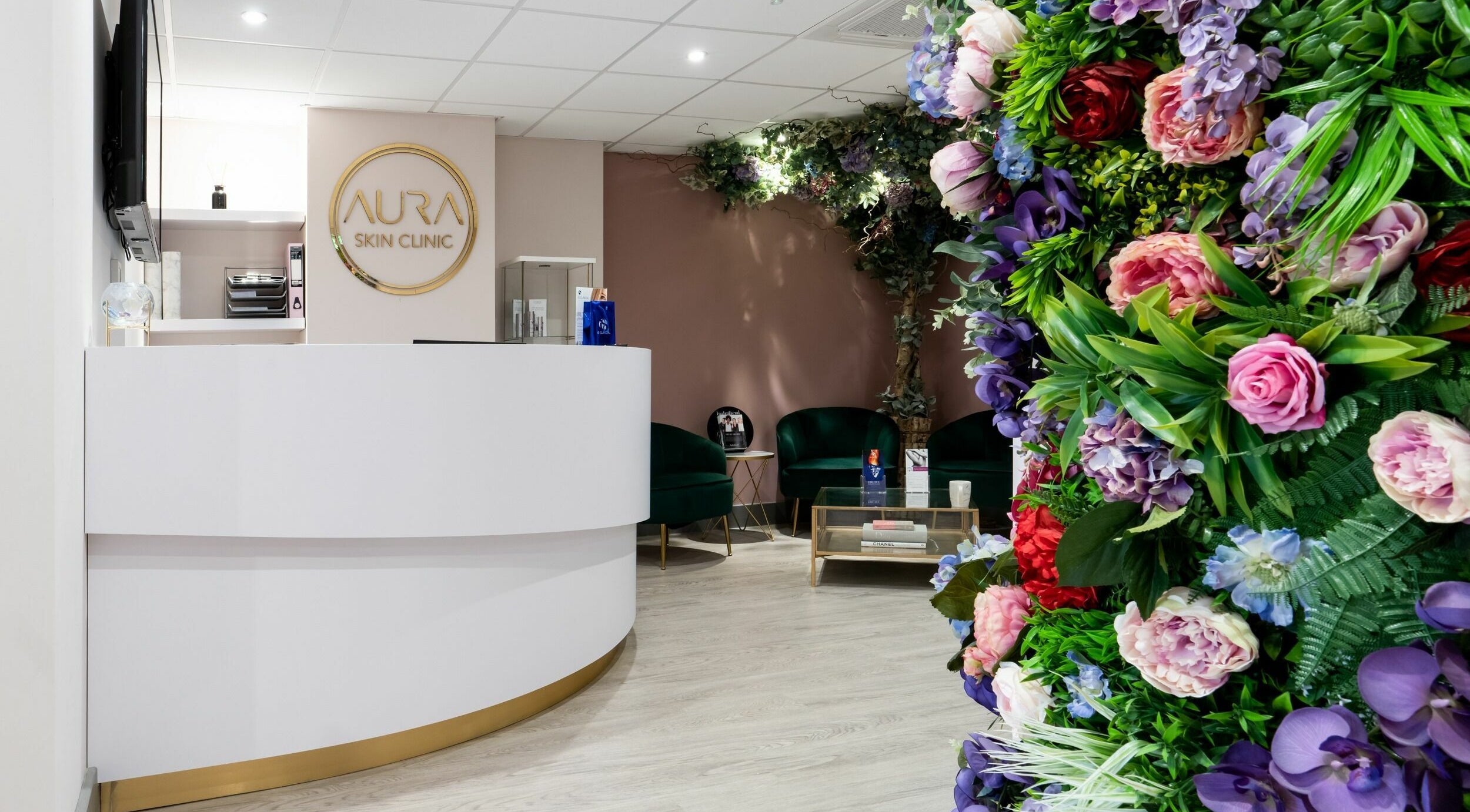 Aura Skin Clinic reception with elegant floral decor in Milton Keynes, England, GB.