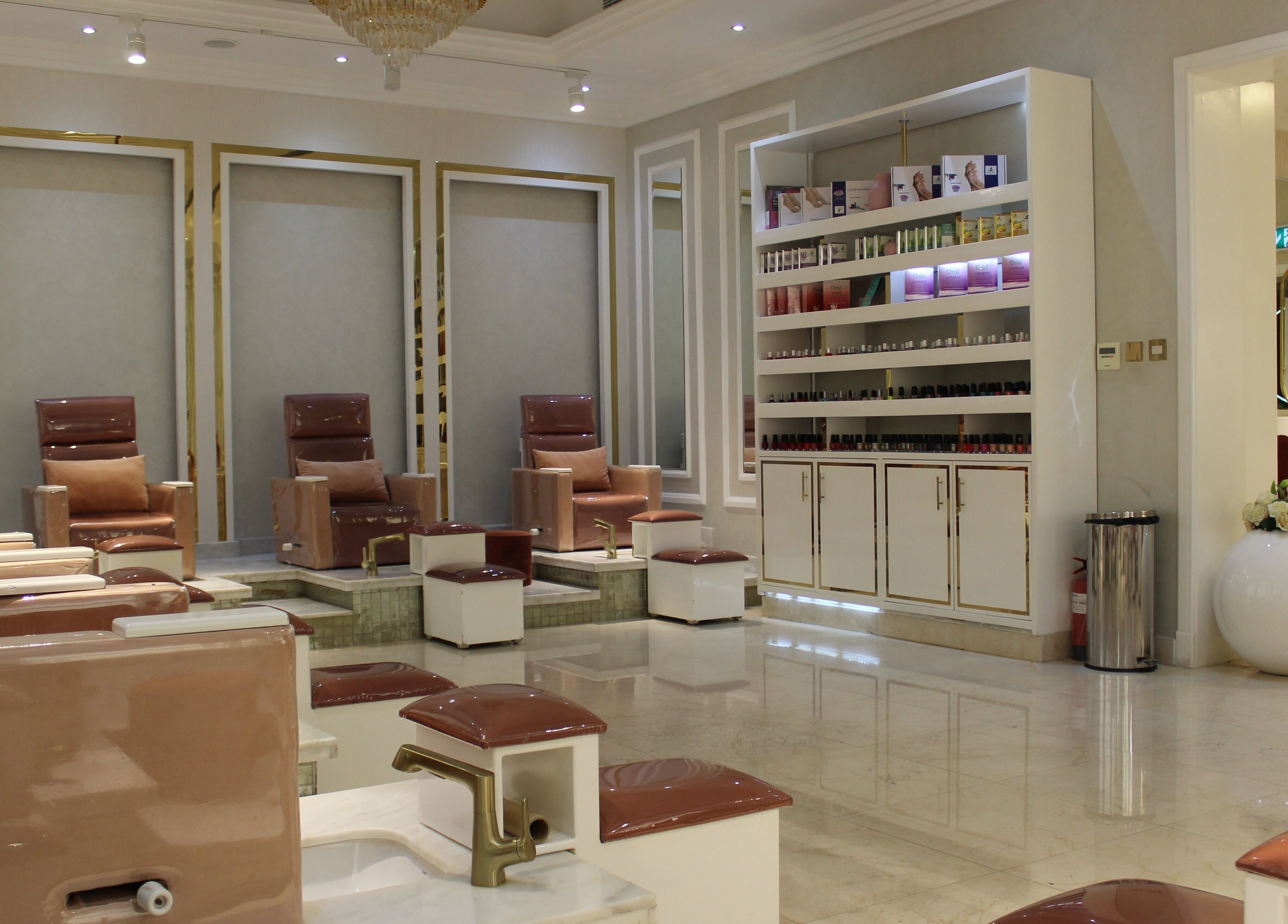 Luxurious pedicure area at Rival Sister Salon L.L.C Sisters in Abu Dhabi, AE with plush seating and polish display.