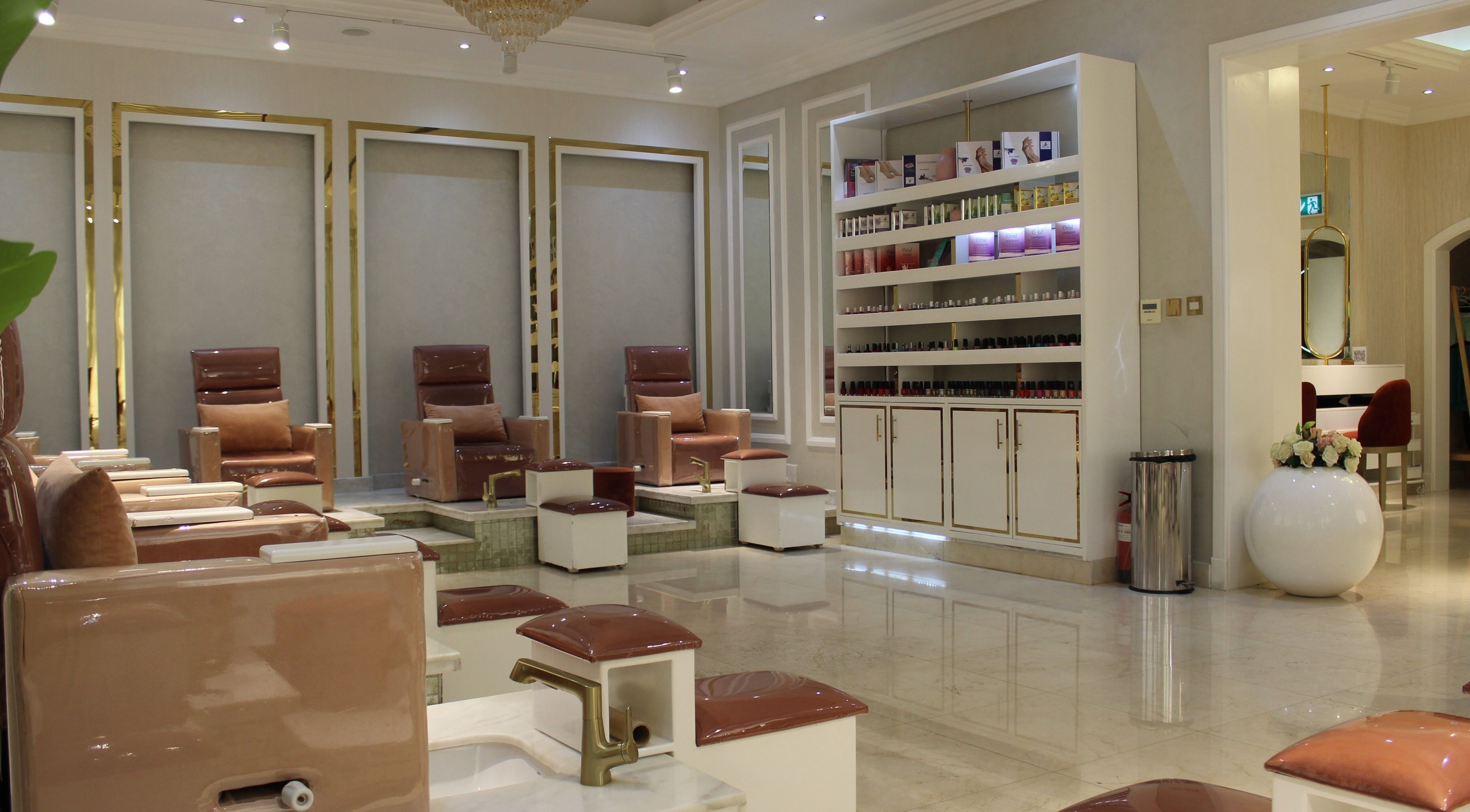 Luxurious pedicure area at Rival Sister Salon L.L.C Sisters in Abu Dhabi, AE with plush seating and polish display.