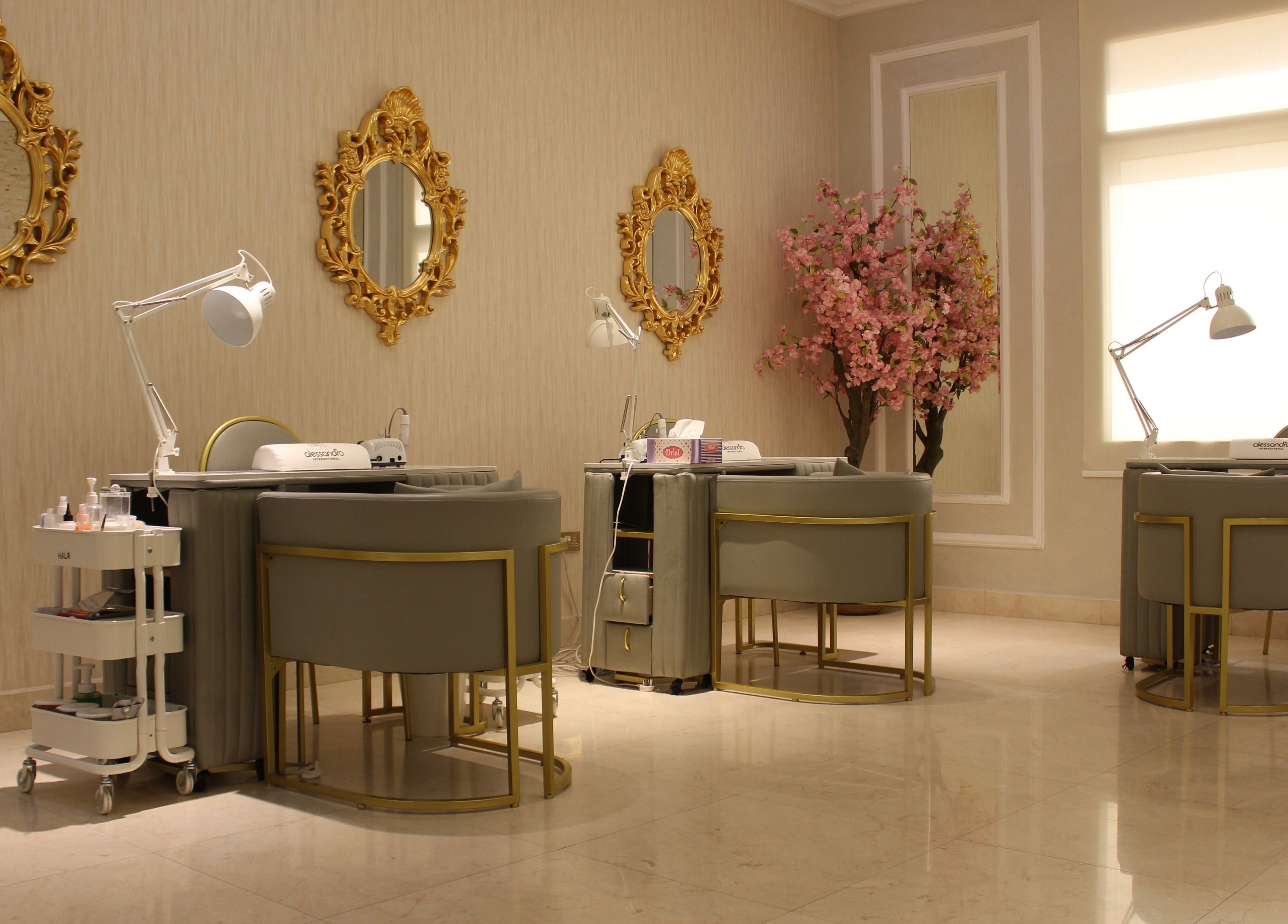 Luxurious salon setup at Rival Sister Salon L.L.C Sisters in Abu Dhabi, AE, featuring elegant gold mirrors.