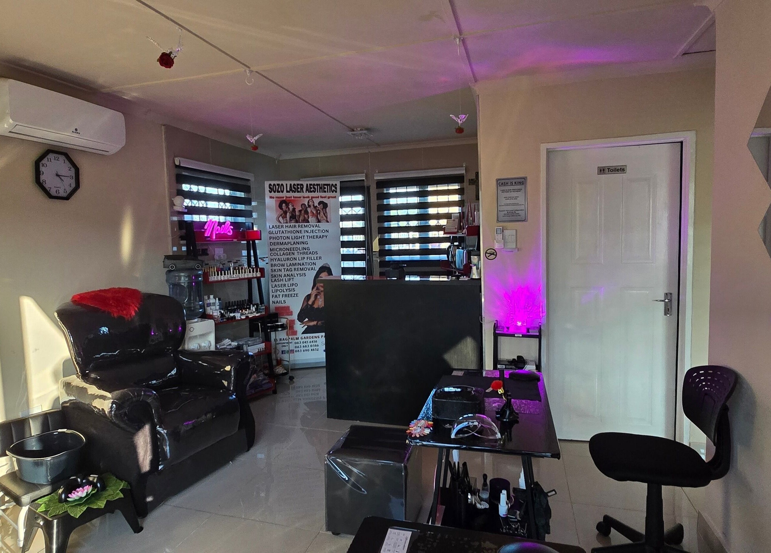 Chic interior of Sozo Laser Aesthetics in Phoenix, Kwazulu-natal, ZA, featuring modern decor and a relaxing atmosphere.