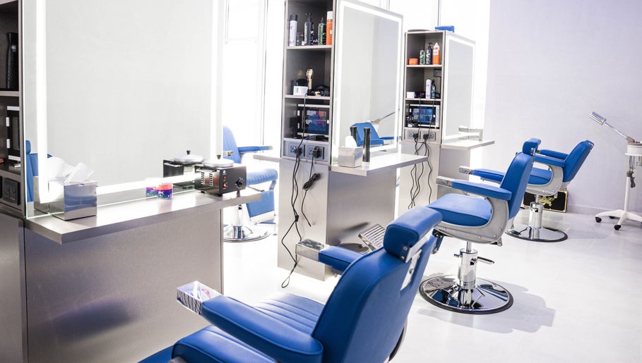 Chic interior of Back Alive Barbershop | Marina in دبي, دبي, AE with sleek barber chairs and mirrors.