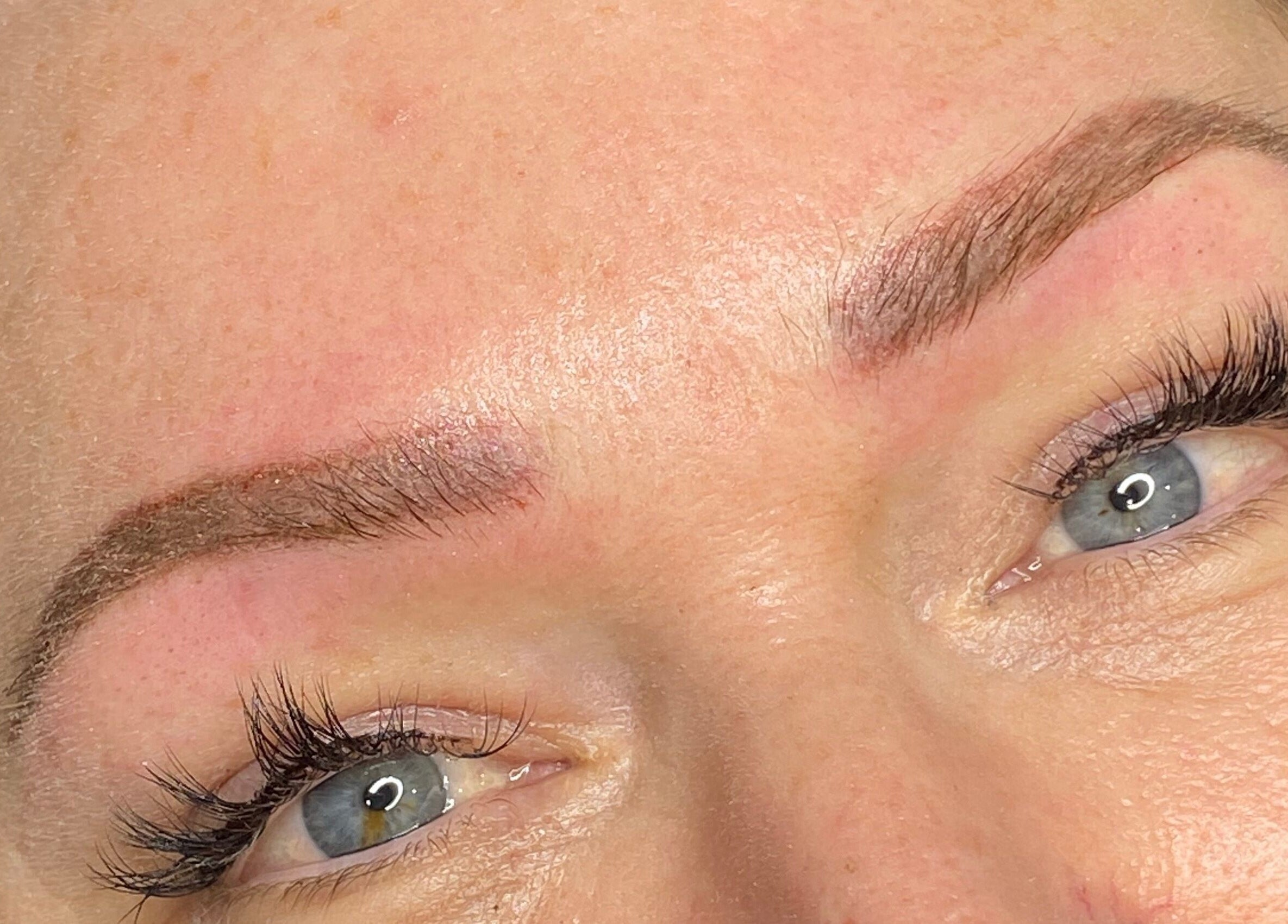 Close-up of refined eyebrow work by Tiffany MacDonald in Weybridge, England, emphasizing permanent makeup and aesthetics.
