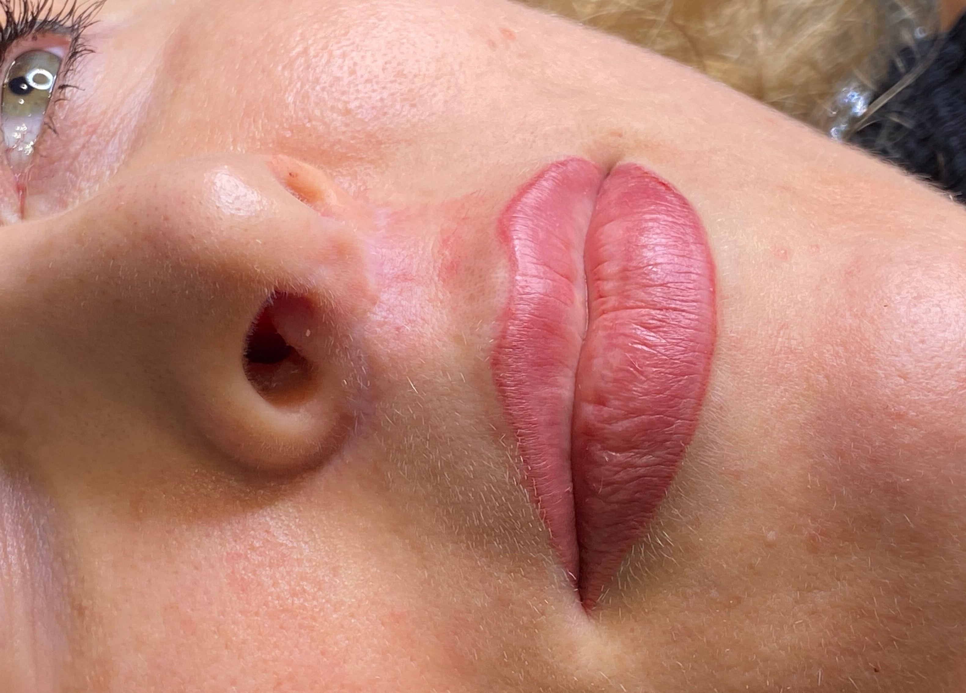 Close-up of freshly done lips at Tiffany MacDonald - Permanent Make Up in Weybridge, England, GB.