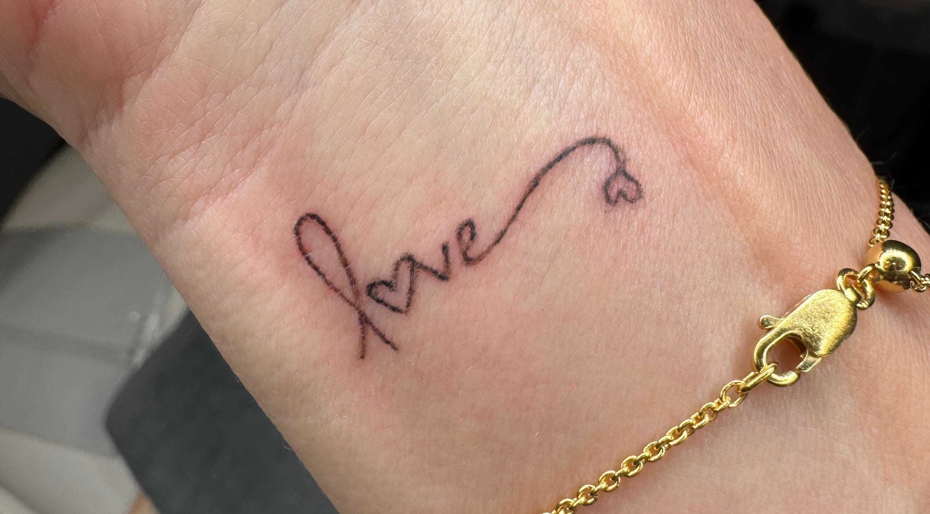 Delicate 'love' tattoo on wrist by Tiffany MacDonald - Permanent Make-Up - Scalp SMP - Fine Line Tattoo, Weybridge, England, GB.