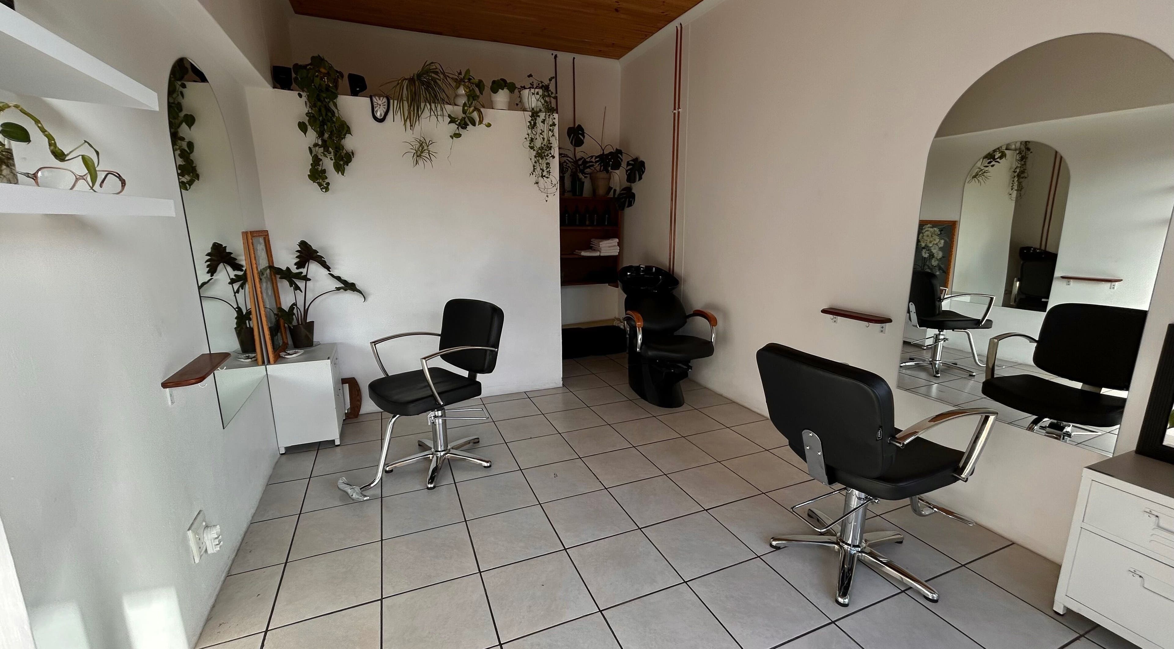 Modern salon chairs and mirrors at Flowers Hair Studio, Cape Town, Western Cape, ZA.