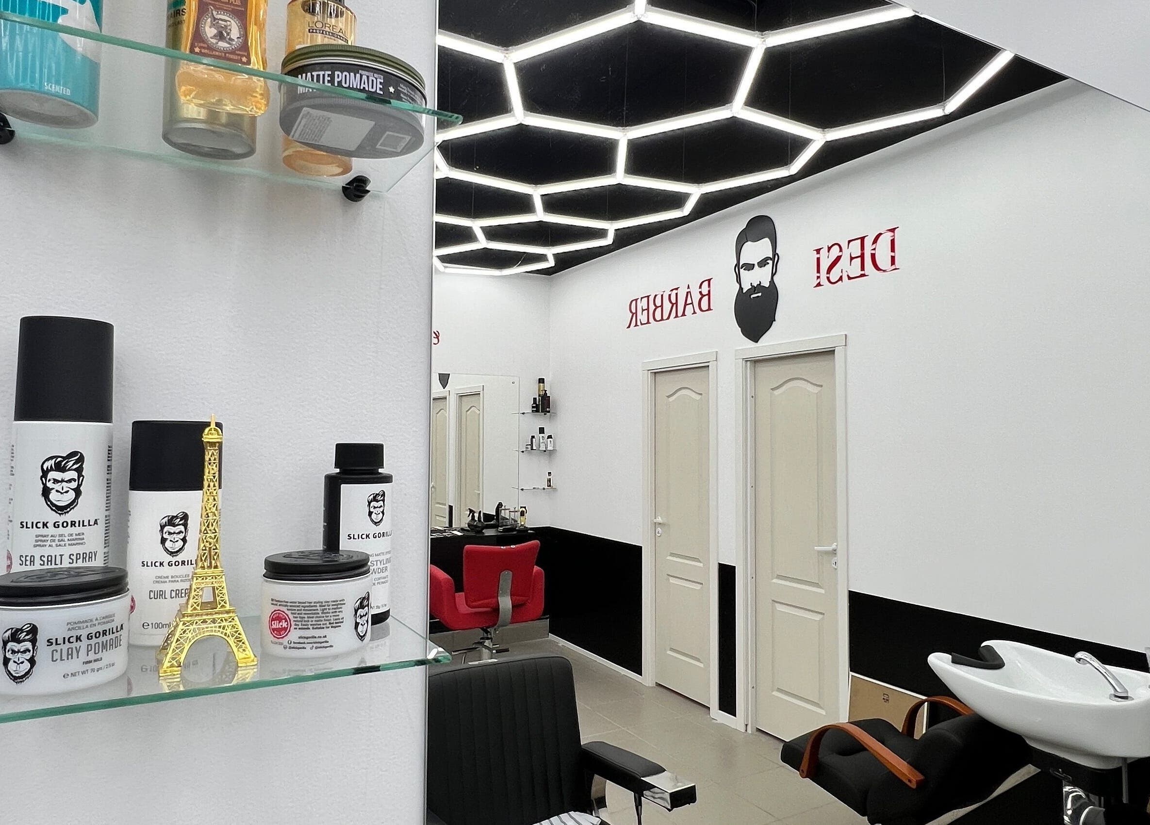 Chic interior of Desi (Āgenskalna Tirgus) barbershop in Rīga, LV, featuring grooming products and stylish decor.