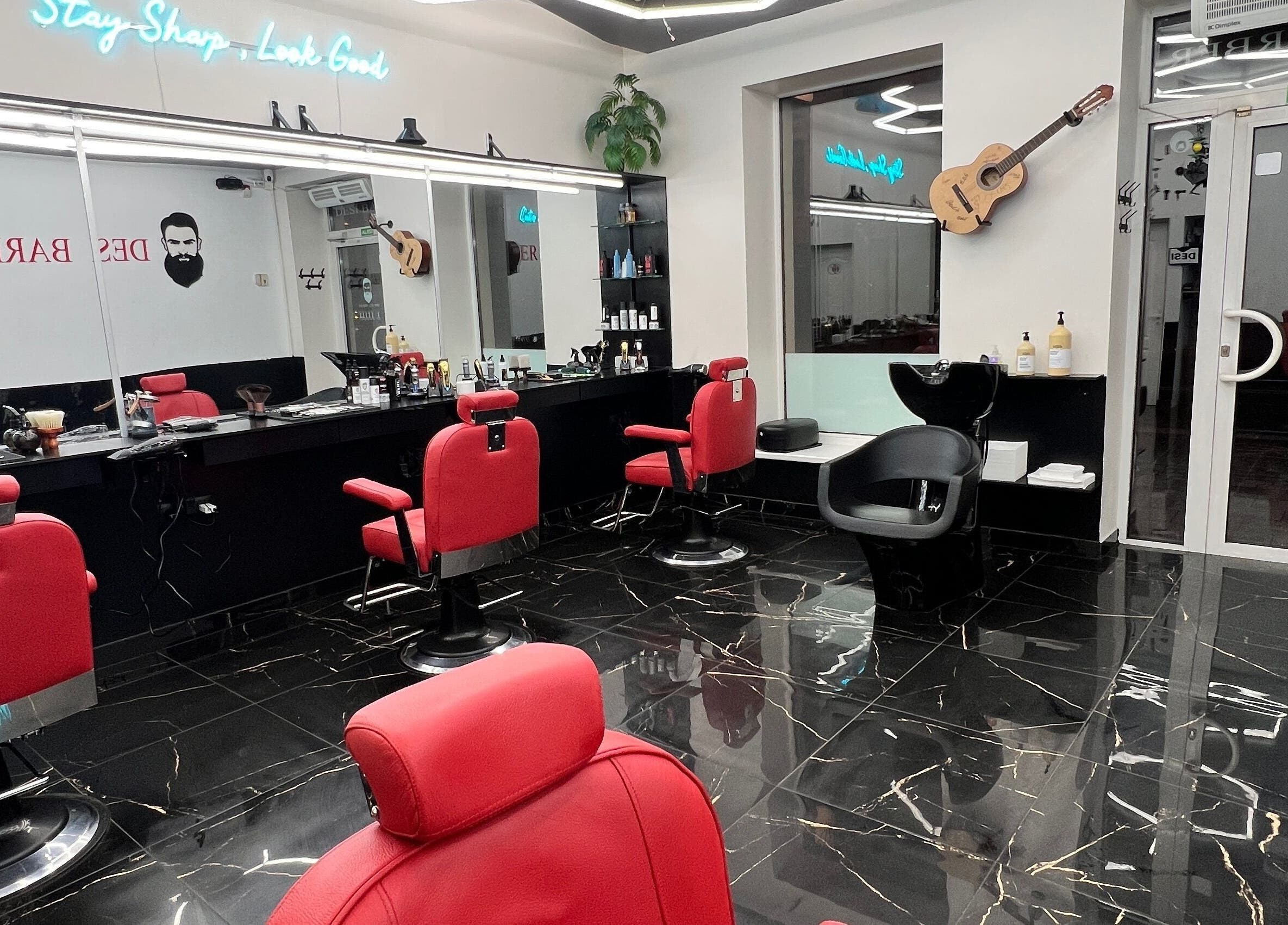 Luxurious barber chairs in Desi (Aleksandra Caka), Rīga, LV, offering sleek grooming services.