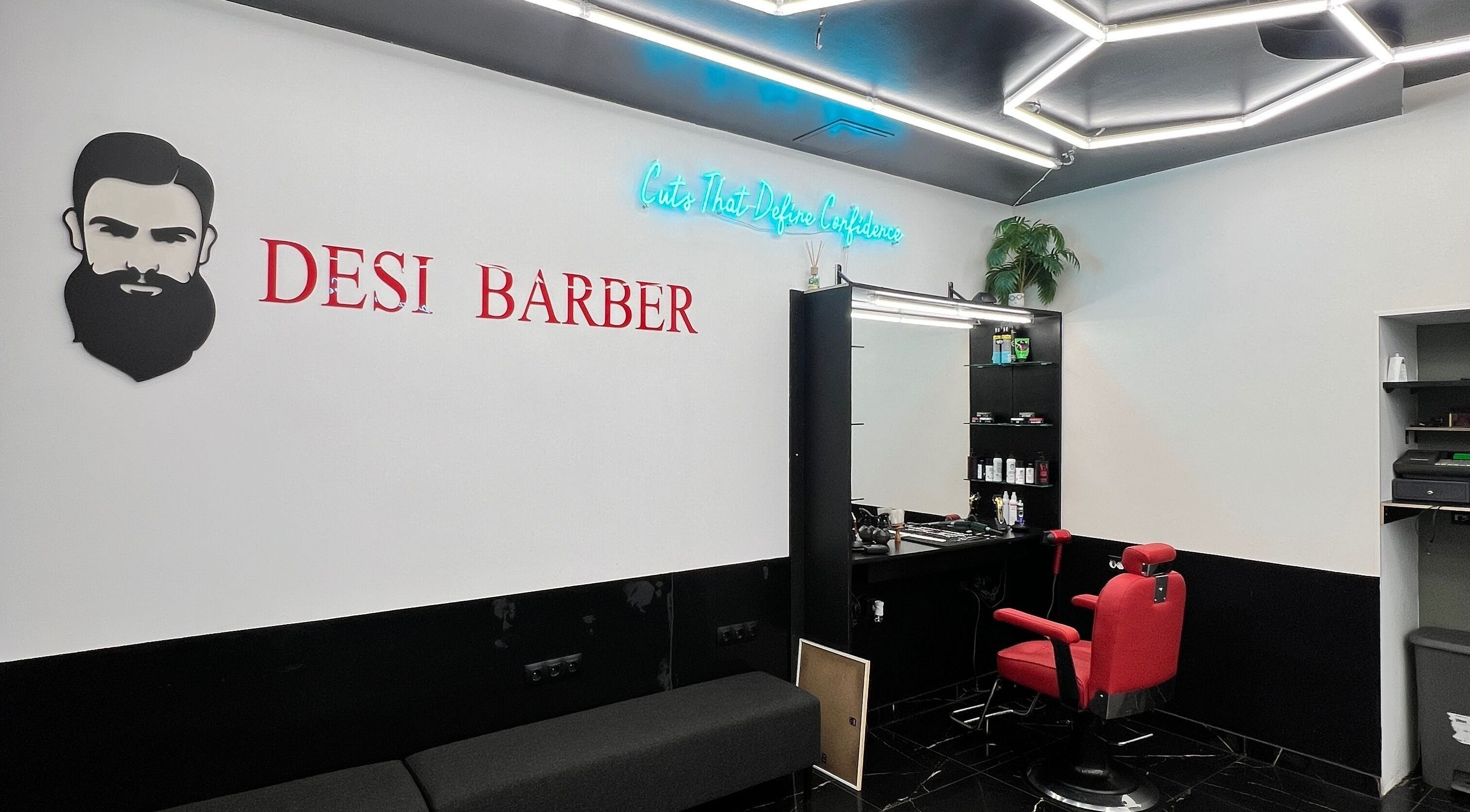 Modern barber station at Desi (Aleksandra Caka) in Rīga, LV with bold decor and vibrant red chair.