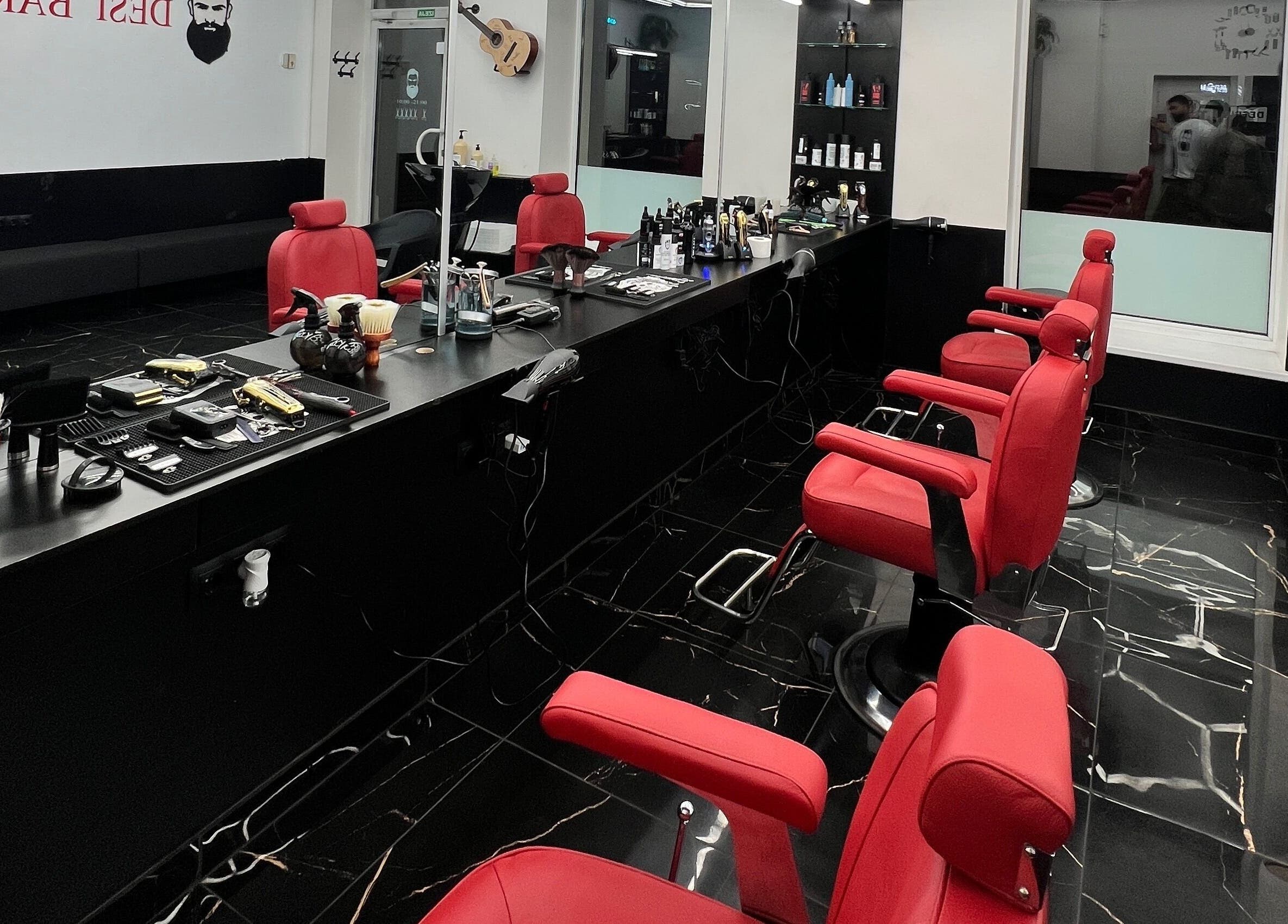 Elegant salon setup with red chairs at Desi (Aleksandra Caka), Rīga, LV.
