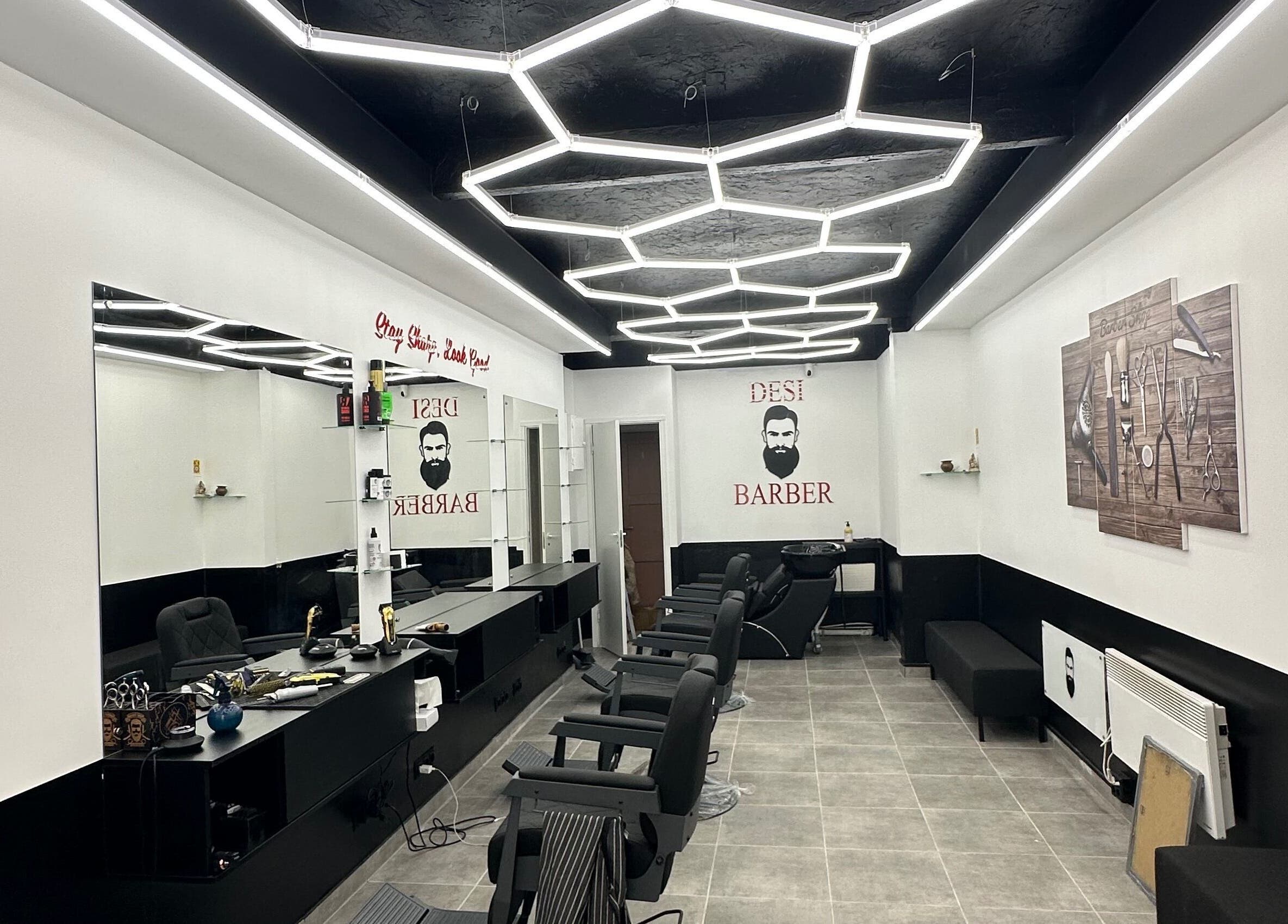 Modern barber shop at Desi (Brivibas Iela) in Rīga, LV with stylish hexagon lighting and sleek interior design.