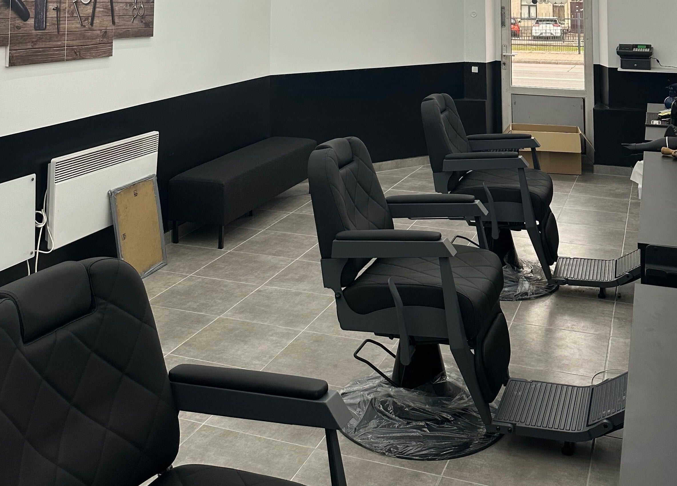 Modern barber chairs at Desi (Brivibas Iela), a beauty and wellness venue in Rīga, LV, with a stylish interior.