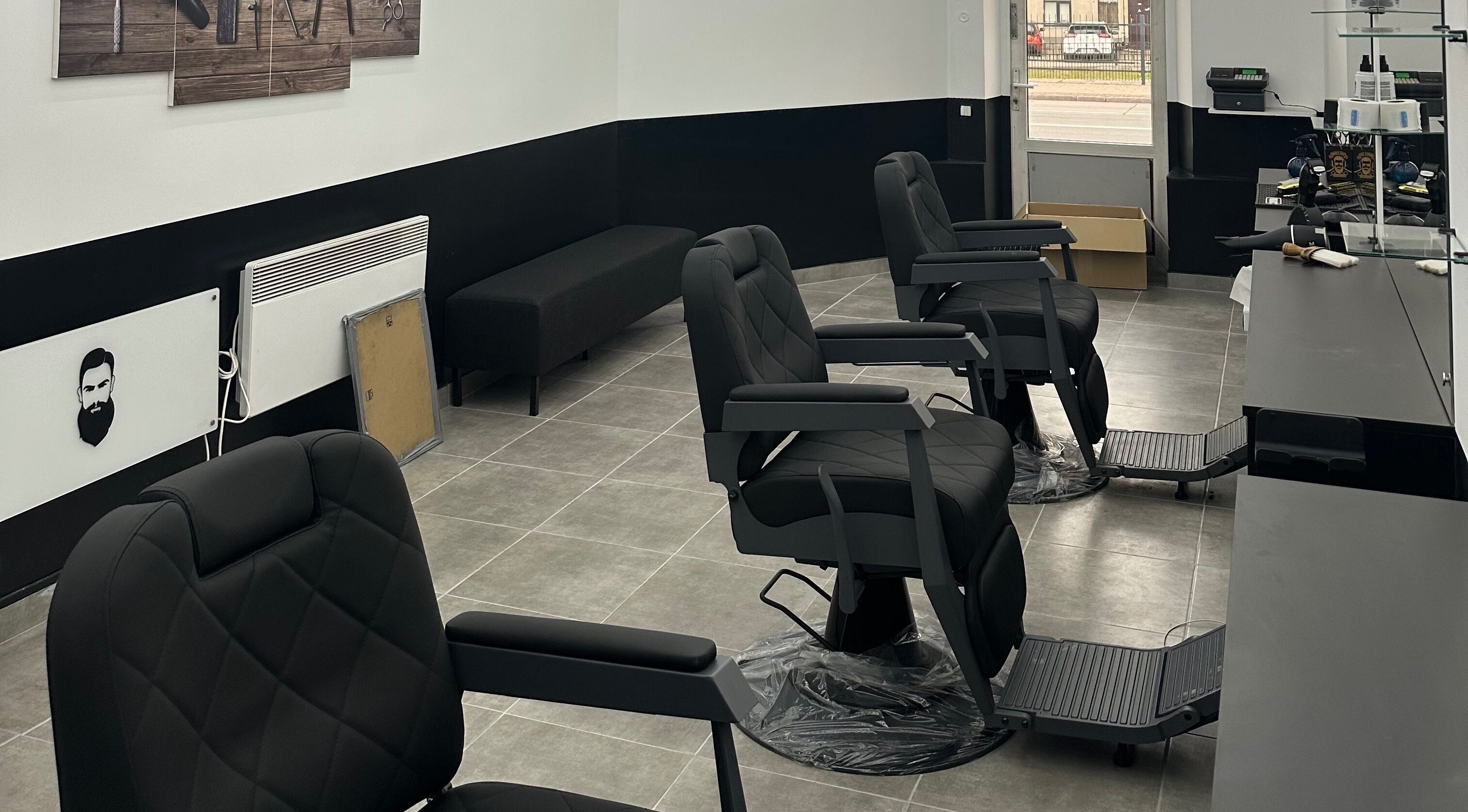 Modern barber chairs at Desi (Brivibas Iela), a beauty and wellness venue in Rīga, LV, with a stylish interior.