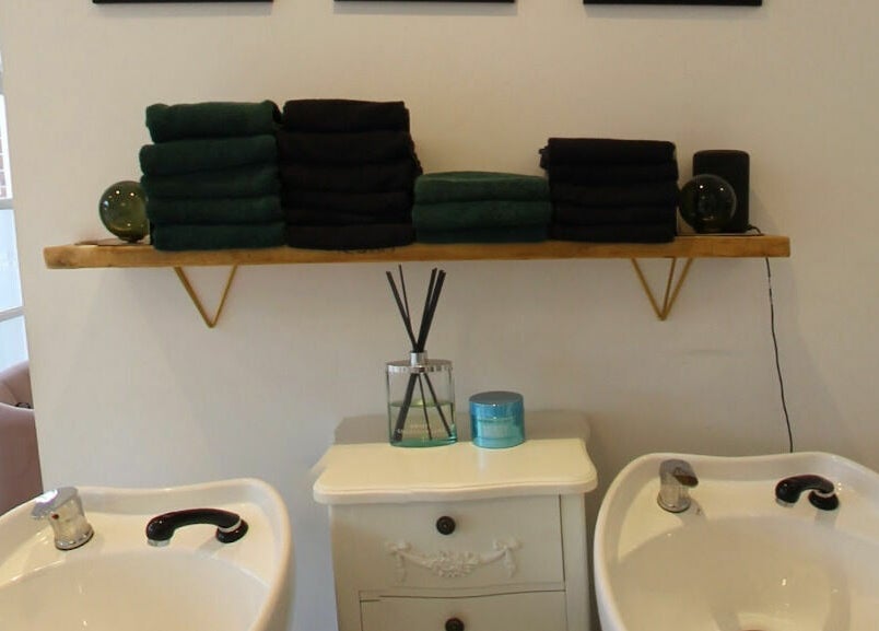 Chic dual basins with decorative shelf in Studio 66, Broxbourne, England, GB.