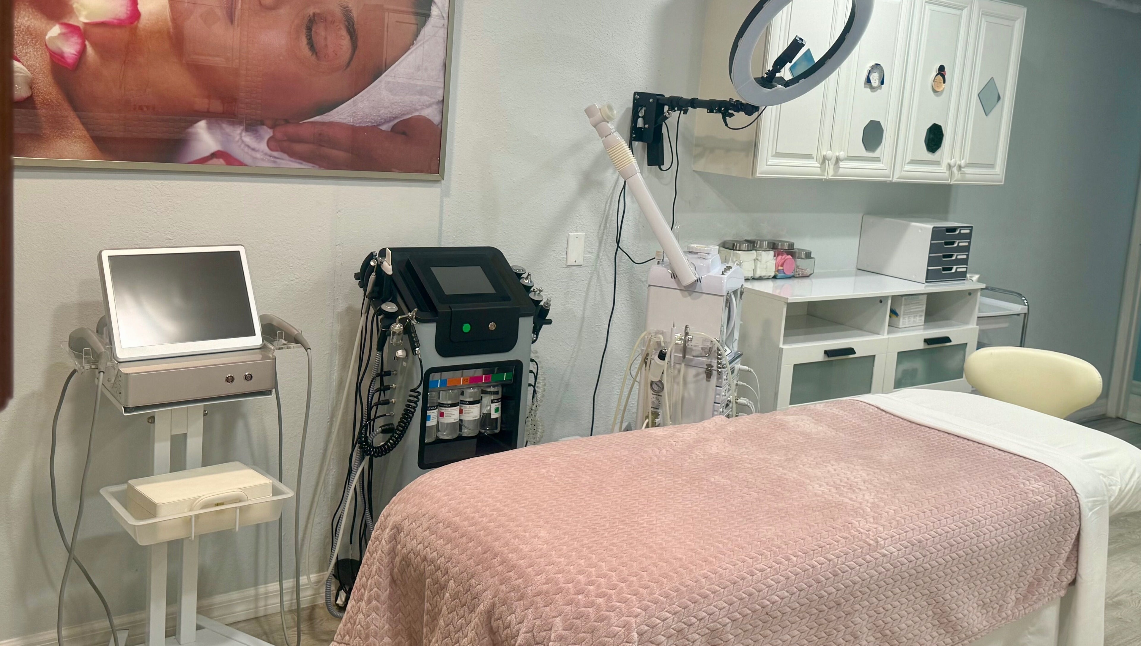 Modern treatment room at Inalvis Oasis Spa, Fort Myers, Florida, US with facial equipment and a relaxing vibe.